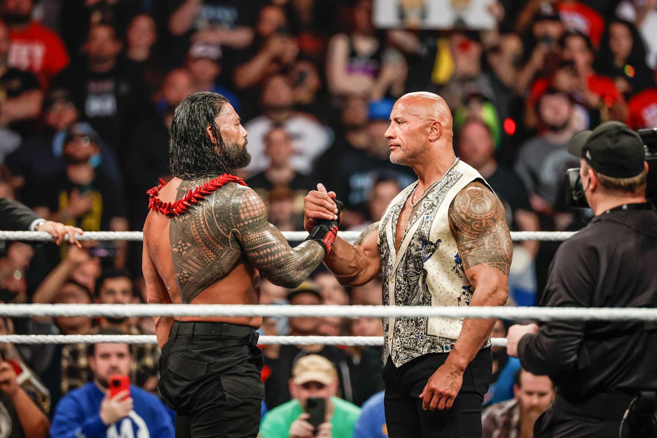 INGLEWOOD, CALIFORNIA - JANUARY 6: Roman Reigns and Dwayne "The Rock" Johnson embrace during RAW at Intuit Dome on January 6, 2025 in Inglewood, California. (Photo by WWE/Getty Images) INGLEWOOD, CALIFORNIA - JANUARY 6: Roman Reigns and Dwayne "The Rock" Johnson embrace during RAW at Intuit Dome on January 6, 2025 in Inglewood, California. (Photo by WWE/Getty Images)