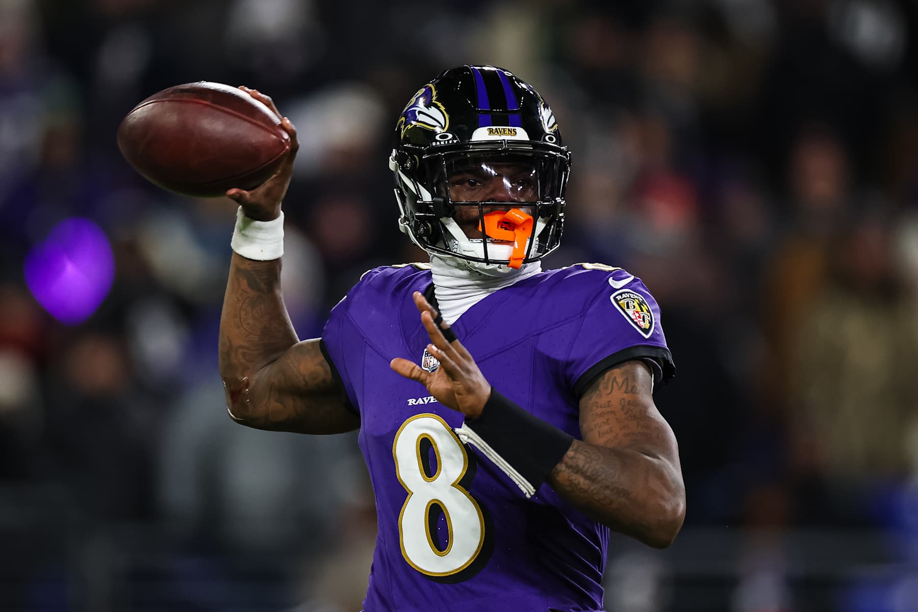BALTIMORE, MD - JANUARY 04: Lamar Jackson #8 of the Baltimore Ravens attempts a pass against the Cleveland Browns during the first half at M&T Bank Stadium on January 4, 2025 in Baltimore, Maryland. (Photo by Scott Taetsch/Getty Images)