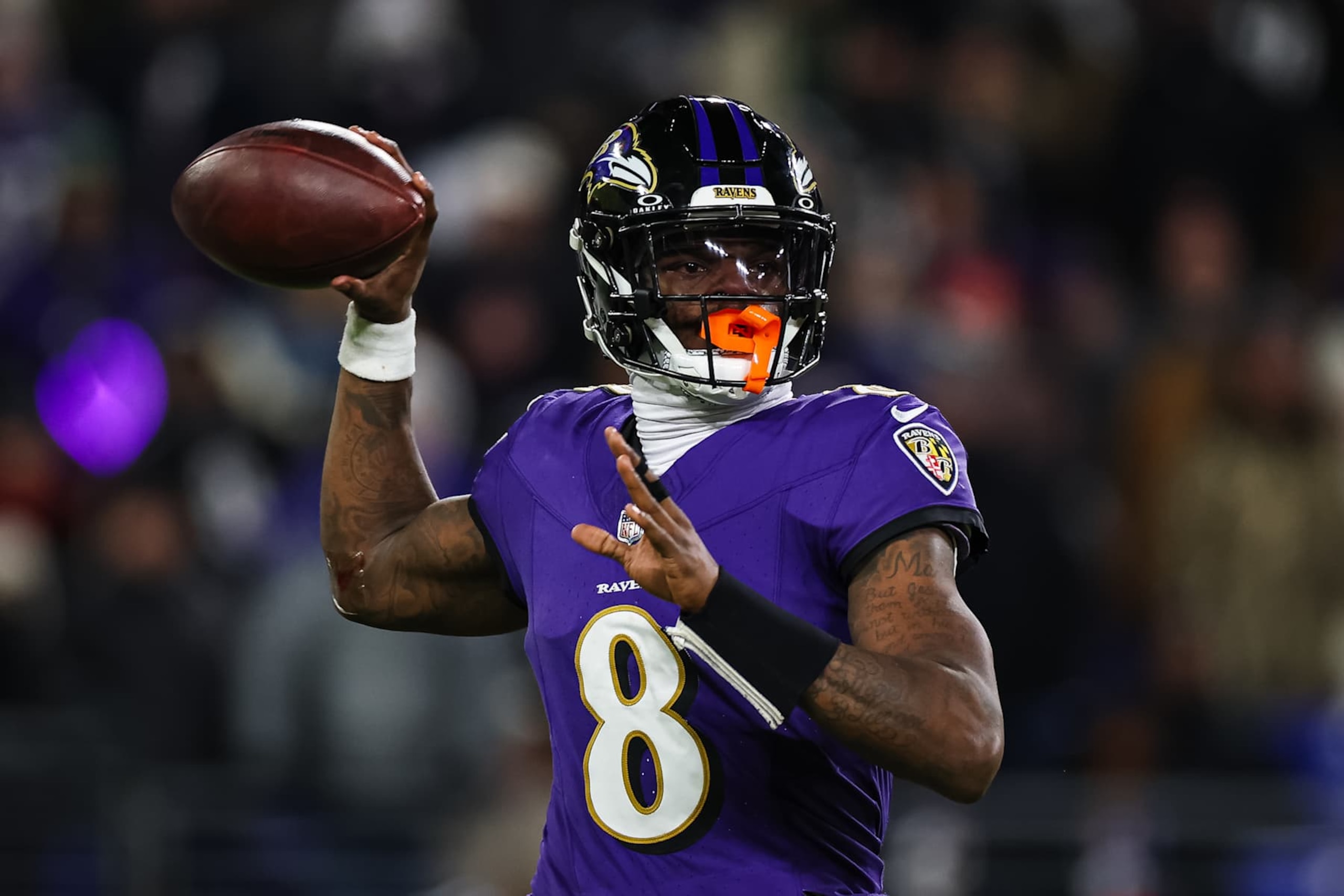 BALTIMORE, MD - JANUARY 04: Lamar Jackson #8 of the Baltimore Ravens attempts a pass against the Cleveland Browns during the first half at M&T Bank Stadium on January 4, 2025 in Baltimore, Maryland. (Photo by Scott Taetsch/Getty Images)