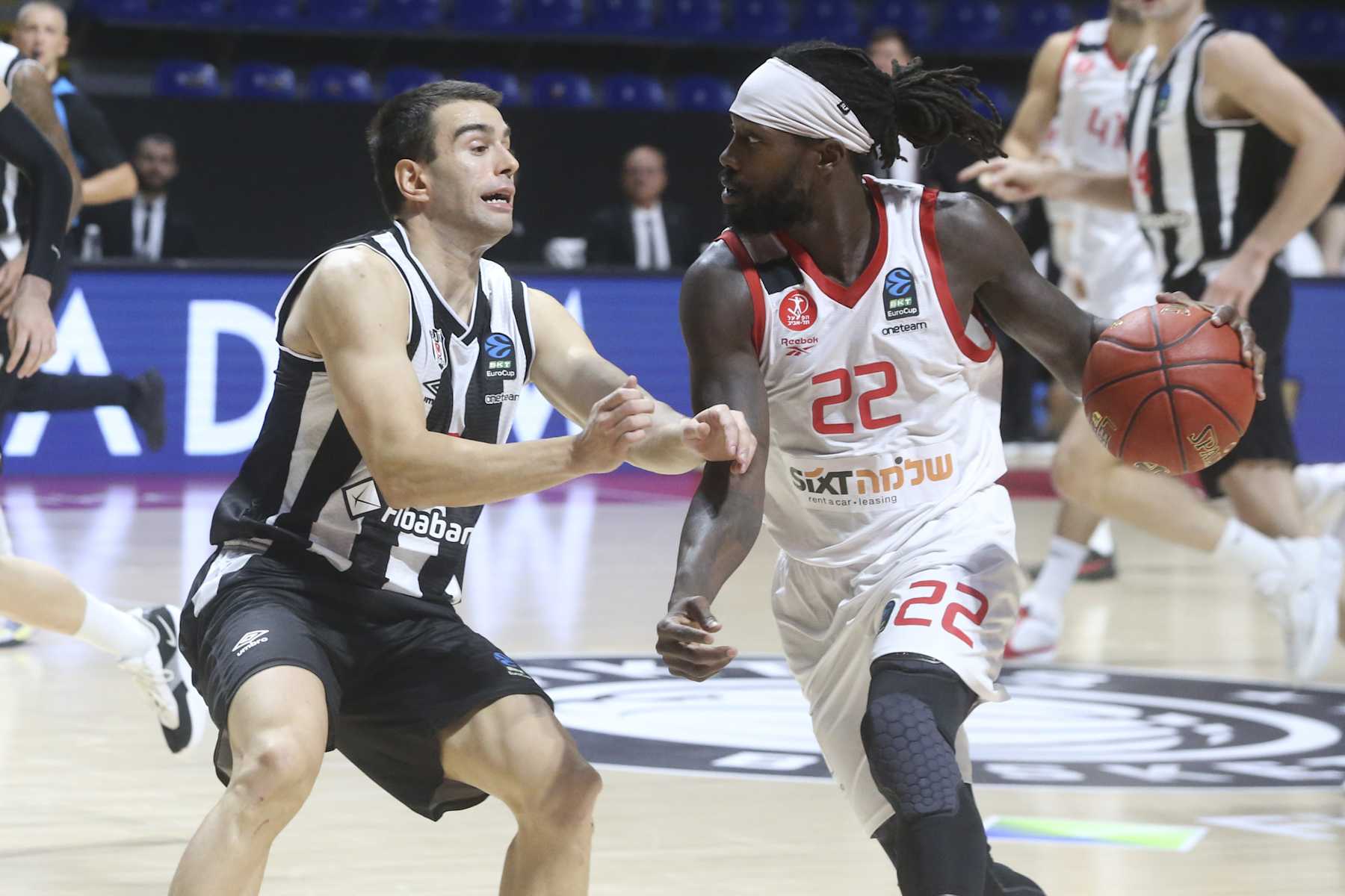 BELGRADE, SERBIA - OCTOBER 08: Berk Ugurlu (L) of Besiktas Fibabanka in action against Patrick Beverley (22) of Hapoel Shlomo Tel Aviv during the BKT EuroCup Group A week 3 match between Besiktas Fibabanka and Hapoel Shlomo Tel Aviv at Aleksandar Nikolic Hall in Belgrade, Serbia on October 08, 2024. (Photo by Filip Stevanovic/Anadolu via Getty Images)