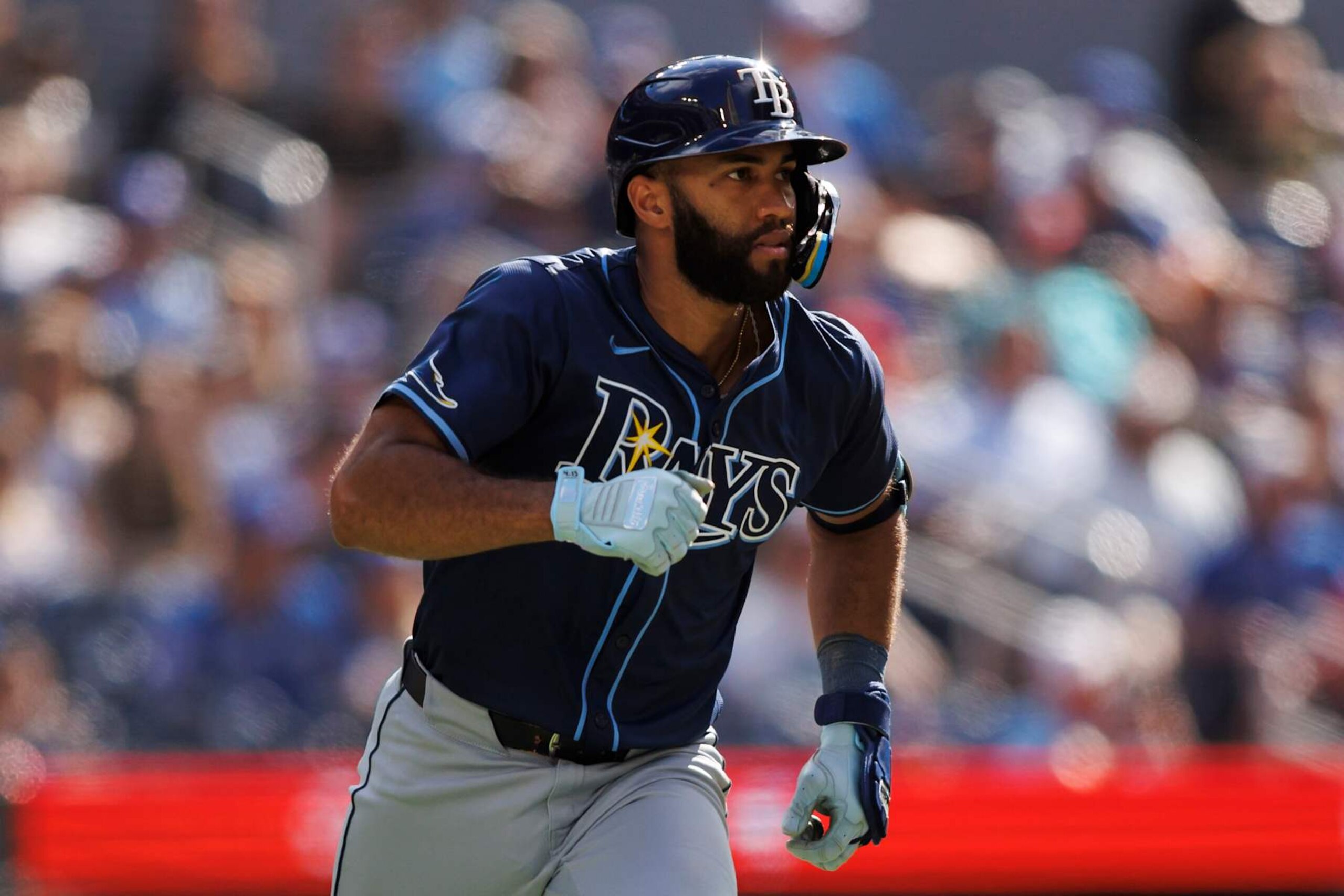 TORONTO, CANADA - JULY 25: Amed Rosario #10 of the Tampa Bay Rays runs out a double in the seventh inning of their MLB game against the Toronto Blue Jays at Rogers Centre on July 25, 2024 in Toronto, Ontario, Canada. (Photo by Cole Burston/Getty Images)