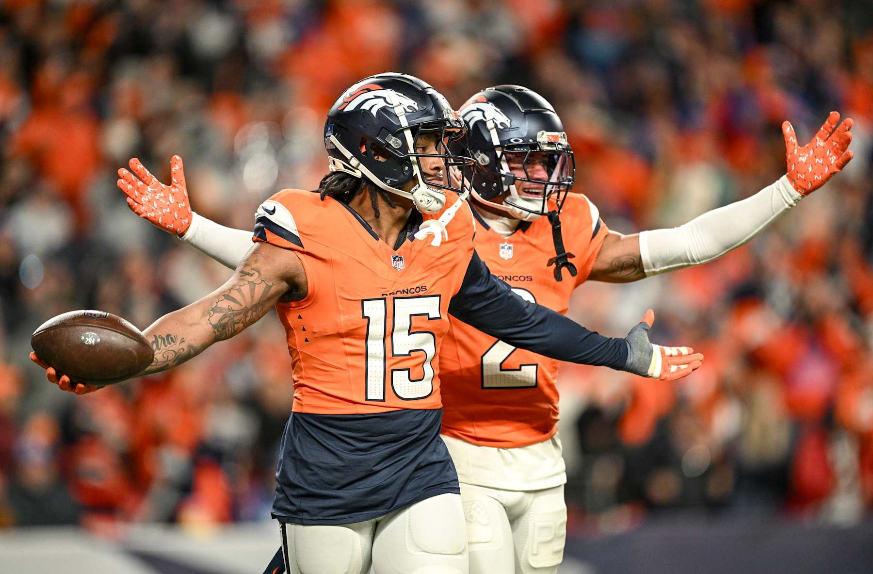 DENVER, CO - DECEMBER 15: Nik Bonitto (15) of the Denver Broncos celebrates housing a pick-six on a pass thrown by Adonai Mitchell (10) of the Indianapolis Colts intended for Anthony Richardson (5) as Pat Surtain II (2) joins in the fun during the fourth quarter at Empower Field at Mile High in Denver on Sunday, December 15, 2024. (Photo by AAron Ontiveroz/The Denver Post)