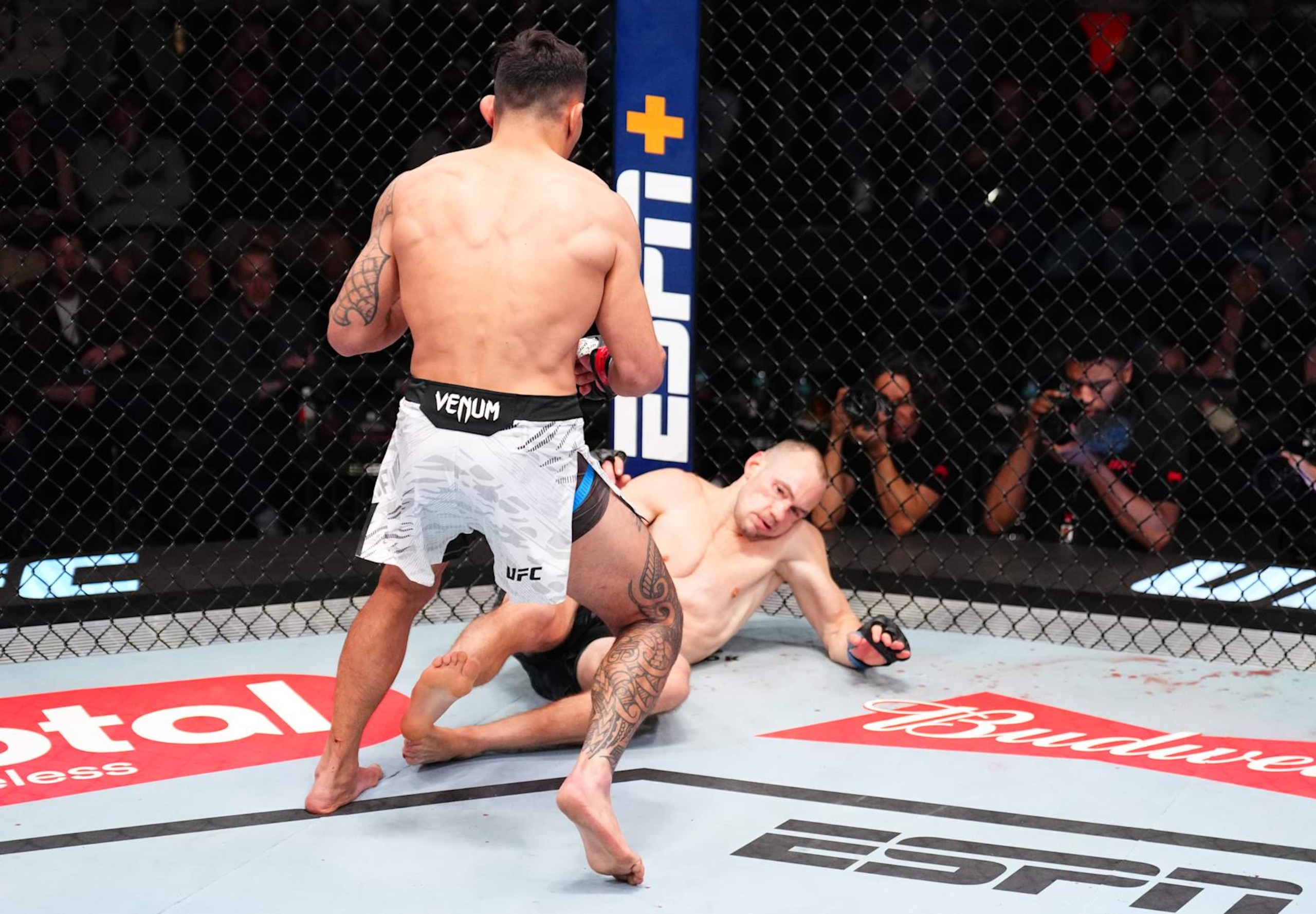 LAS VEGAS, NEVADA - JANUARY 11: (L-R) Punahele Soriano knocks down Uros Medic of Serbia in a welterweight fight during the UFC Fight Night event at UFC APEX on January 11, 2025 in Las Vegas, Nevada. (Photo by Chris Unger/Zuffa LLC via Getty Images)
