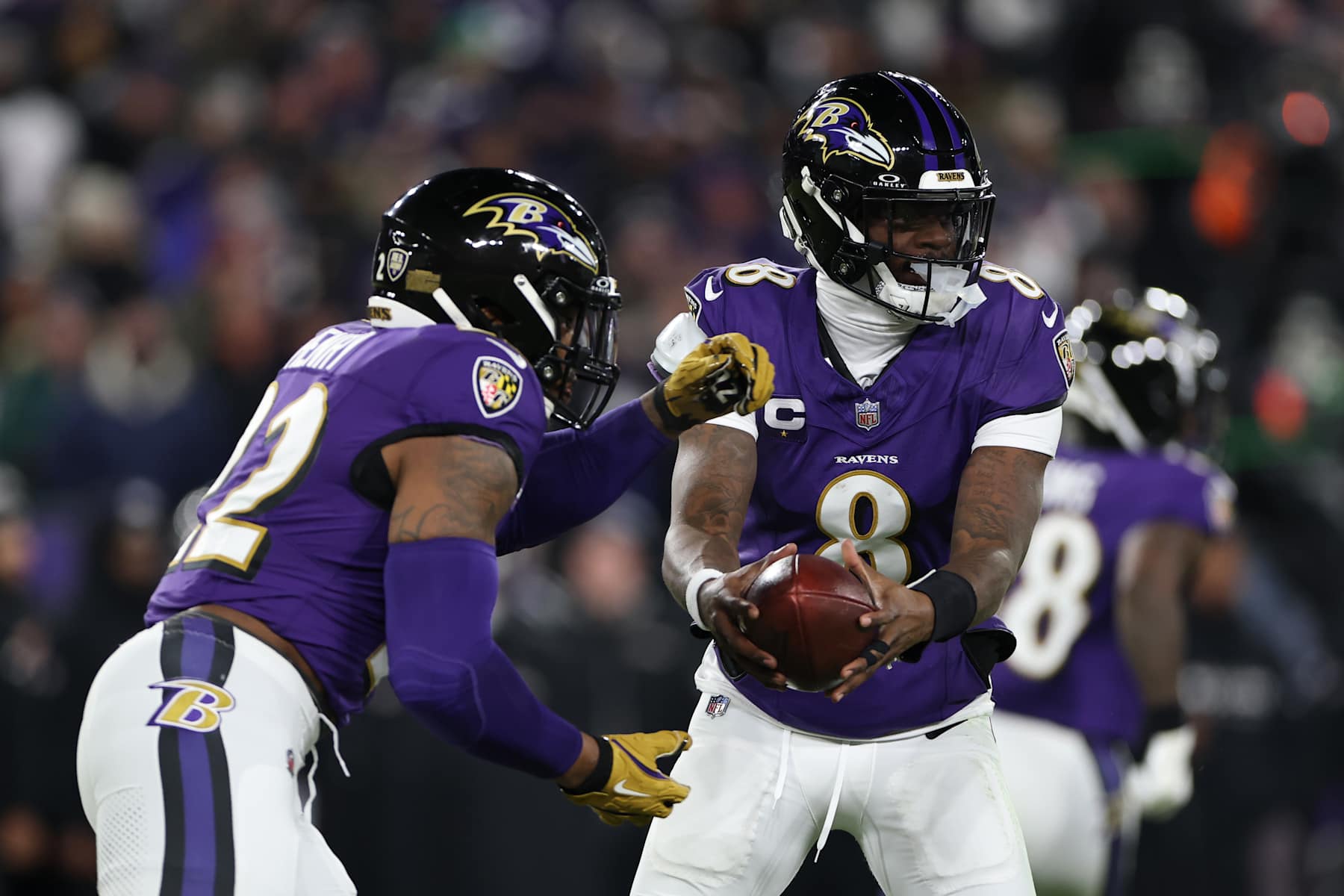BALTIMORE, MARYLAND - JANUARY 11: Lamar Jackson #8 of the Baltimore Ravens hands the ball off to Derrick Henry #22 during the first quarter against the Pittsburgh Steelers during the AFC Wild Card Playoff at M&T Bank Stadium on January 11, 2025 in Baltimore, Maryland. (Photo by Scott Taetsch/Getty Images) BALTIMORE, MARYLAND - JANUARY 11: Lamar Jackson #8 of the Baltimore Ravens hands the ball off to Derrick Henry #22 during the first quarter against the Pittsburgh Steelers during the AFC Wild Card Playoff at M&T Bank Stadium on January 11, 2025 in Baltimore, Maryland. (Photo by Scott Taetsch/Getty Images)