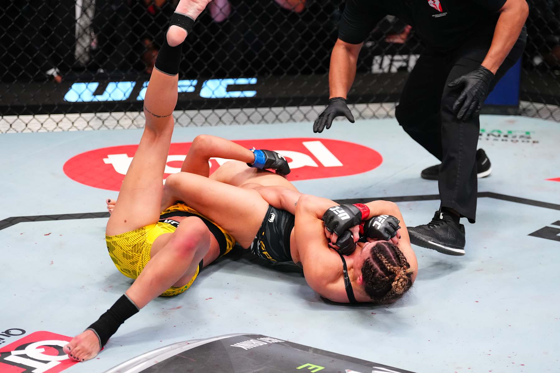 Mackenzie Dern secures an arm bar submission against Amanda Ribas