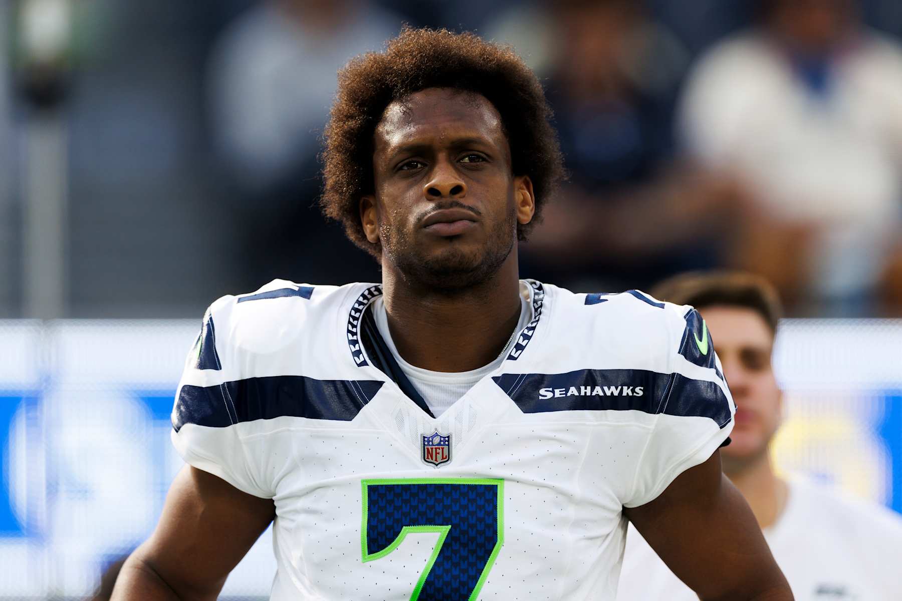 INGLEWOOD, CALIFORNIA - JANUARY 5: Geno Smith #7 of the Seattle Seahawks on the sideline during the fist half against the Los Angeles Rams at SoFi Stadium on January 5, 2025 in Inglewood, California. (Photo by Ric Tapia/Getty Images)