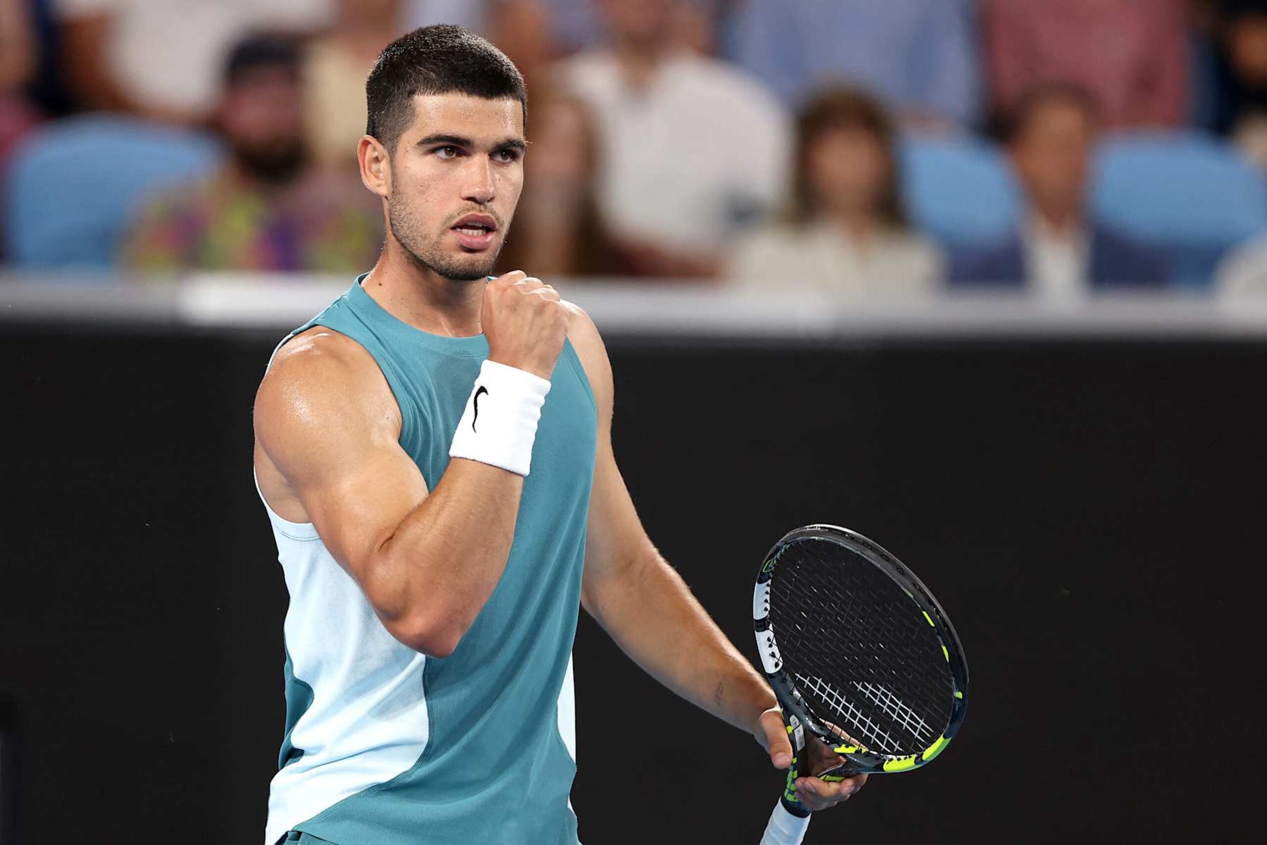 Spain's Carlos Alcaraz celebrates the match point against Kazakhstan's Alexander Shevchenko during their men's singles match on day two of the Australian Open tennis tournament in Melbourne on January 13, 2025. (Photo by Martin KEEP / AFP) / -- IMAGE RESTRICTED TO EDITORIAL USE - STRICTLY NO COMMERCIAL USE -- (Photo by MARTIN KEEP/AFP via Getty Images) Spain's Carlos Alcaraz celebrates the match point against Kazakhstan's Alexander Shevchenko during their men's singles match on day two of the Australian Open tennis tournament in Melbourne on January 13, 2025. (Photo by Martin KEEP / AFP) / -- IMAGE RESTRICTED TO EDITORIAL USE - STRICTLY NO COMMERCIAL USE -- (Photo by MARTIN KEEP/AFP via Getty Images)
