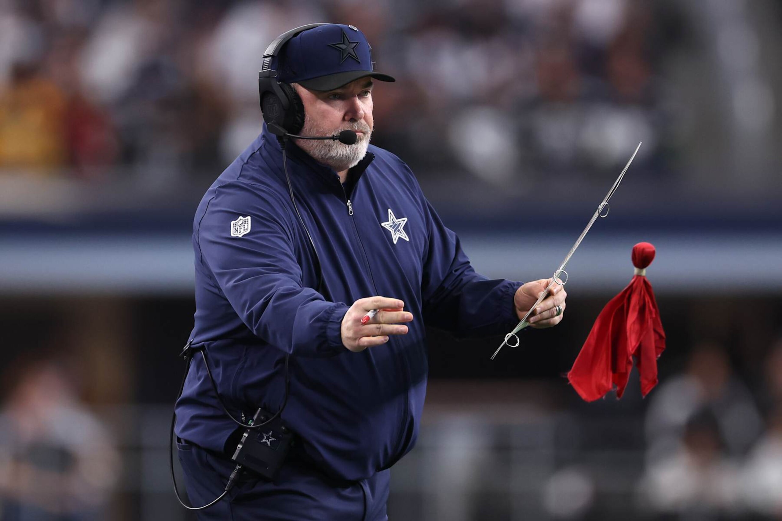 ARLINGTON, TEXAS - JANUARY 05: Dallas Cowboys head coach Mike McCarthy throws a challenge flag during the fourth quarter against the Washington Commanders at AT&T Stadium on January 05, 2025 in Arlington, Texas. (Photo by Sam Hodde/Getty Images) ARLINGTON, TEXAS - JANUARY 05: Dallas Cowboys head coach Mike McCarthy throws a challenge flag during the fourth quarter against the Washington Commanders at AT&T Stadium on January 05, 2025 in Arlington, Texas. (Photo by Sam Hodde/Getty Images)