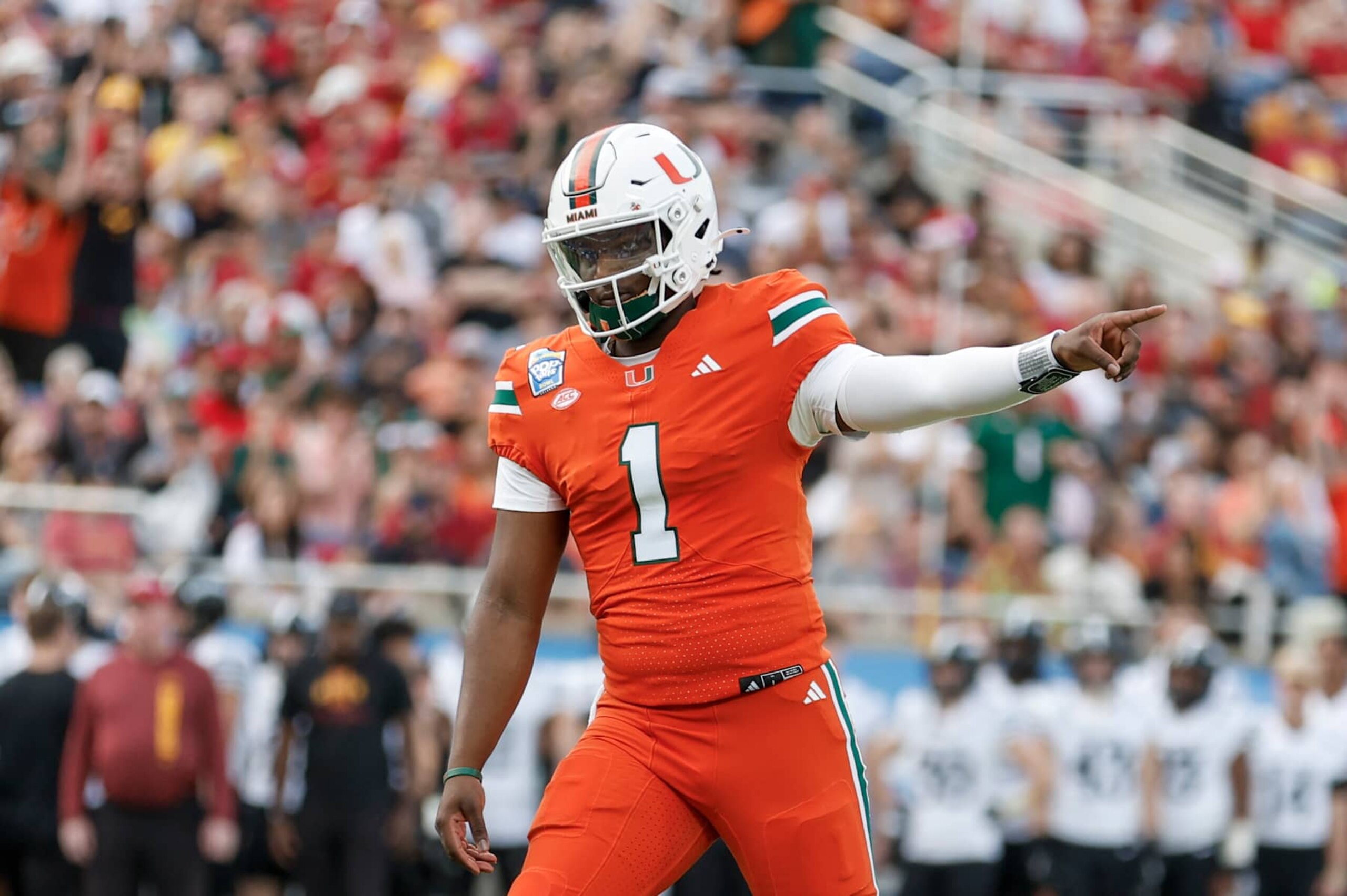 ORLANDO, FL - DECEMBER 28: Miami Hurricanes quarterback Cam Ward (1) reacts after throwing a touchdown pass during the game between the Miami Hurricanes and the Iowa State Cyclones on December 28, 2024 at Camping World Stadium in Orlando, Fl. (Photo by David Rosenblum/Icon Sportswire via Getty Images) ORLANDO, FL - DECEMBER 28: Miami Hurricanes quarterback Cam Ward (1) reacts after throwing a touchdown pass during the game between the Miami Hurricanes and the Iowa State Cyclones on December 28, 2024 at Camping World Stadium in Orlando, Fl. (Photo by David Rosenblum/Icon Sportswire via Getty Images)