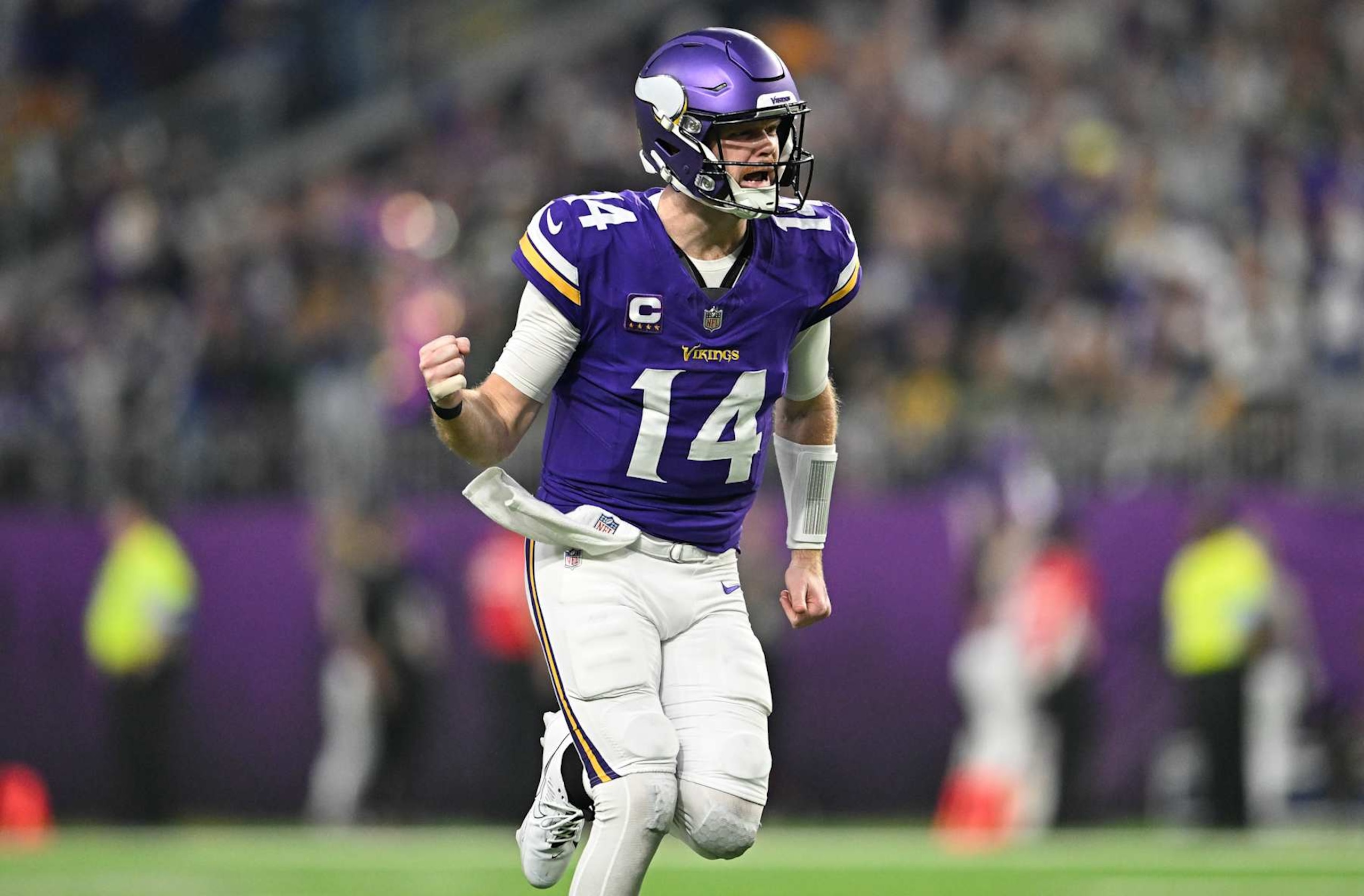 MINNEAPOLIS, MINNESOTA - DECEMBER 29: Quarterback Sam Darnold #14 of the Minnesota Vikings reacts after a throwing a touchdown pass during the second quarter against the Green Bay Packers at U.S. Bank Stadium on December 29, 2024 in Minneapolis, Minnesota. (Photo by Stephen Maturen/Getty Images) MINNEAPOLIS, MINNESOTA - DECEMBER 29: Quarterback Sam Darnold #14 of the Minnesota Vikings reacts after a throwing a touchdown pass during the second quarter against the Green Bay Packers at U.S. Bank Stadium on December 29, 2024 in Minneapolis, Minnesota. (Photo by Stephen Maturen/Getty Images)