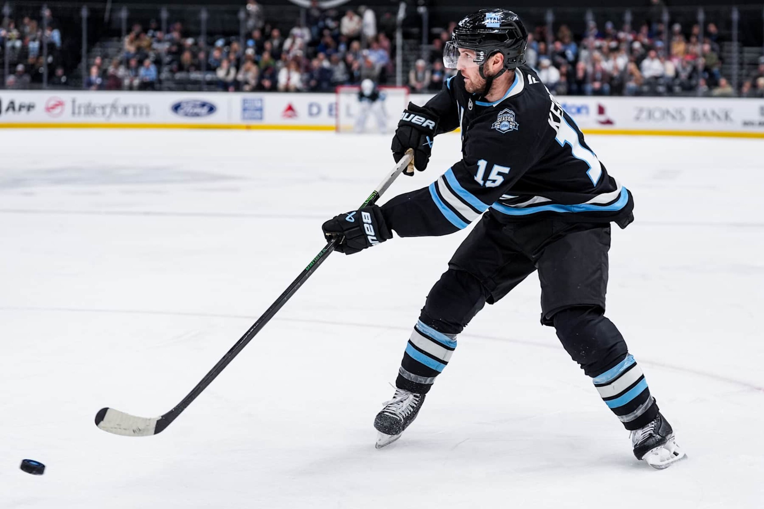 SALT LAKE CITY, UTAH - JANUARY 11: Alex Kerfoot #15 of the Utah Hockey Club passes the puck during the second period against the New York Islanders on January 11, 2025 at Delta Center in Salt Lake City, Utah.  (Photo by Hunter Dyke/NHLI via Getty Images)