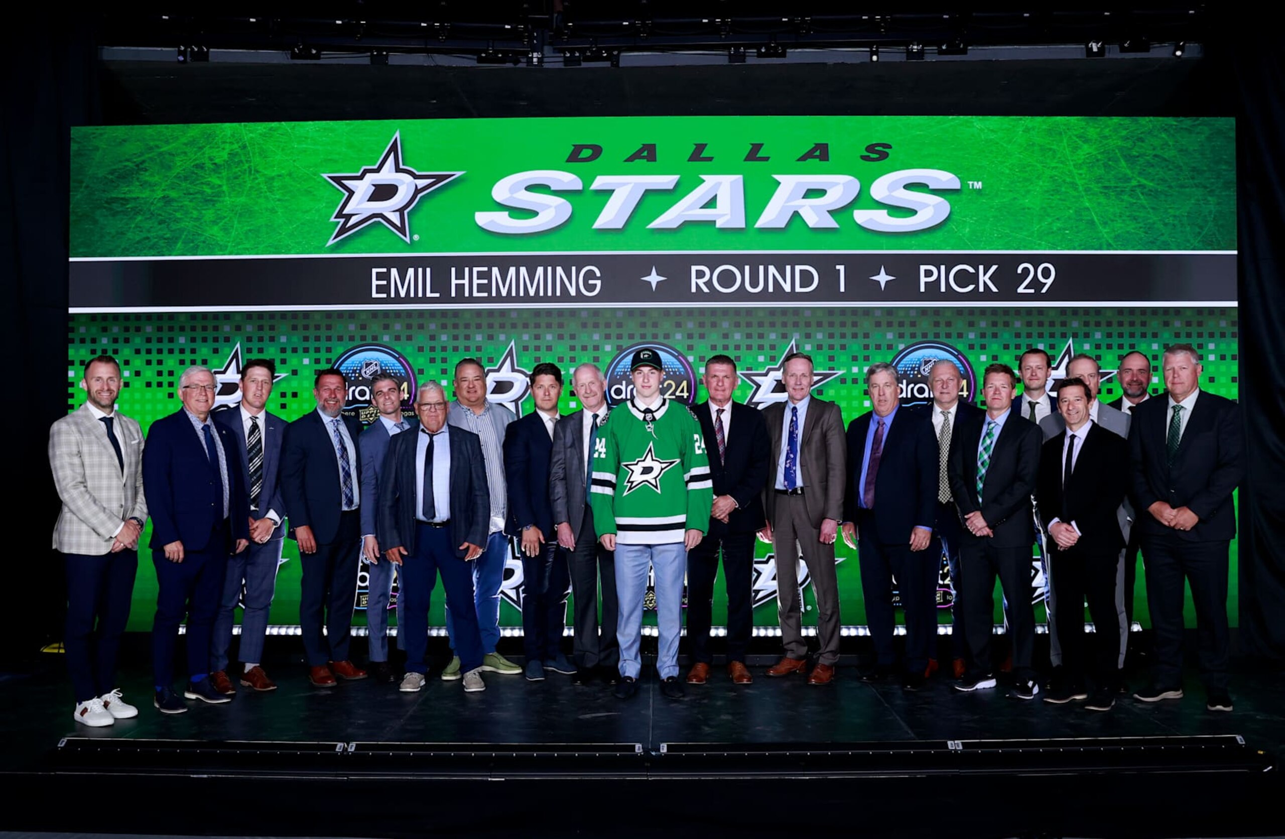 LAS VEGAS, NEVADA - JUNE 28: Emil Hemming poses for a group photo with general manager Jim Nill and team personnel after being selected 29th overall by the Dallas Stars during the first round of the 2024 Upper Deck NHL Draft at Sphere on June 28, 2024 in Las Vegas, Nevada. (Photo by Jeff Vinnick/NHLI via Getty Images)