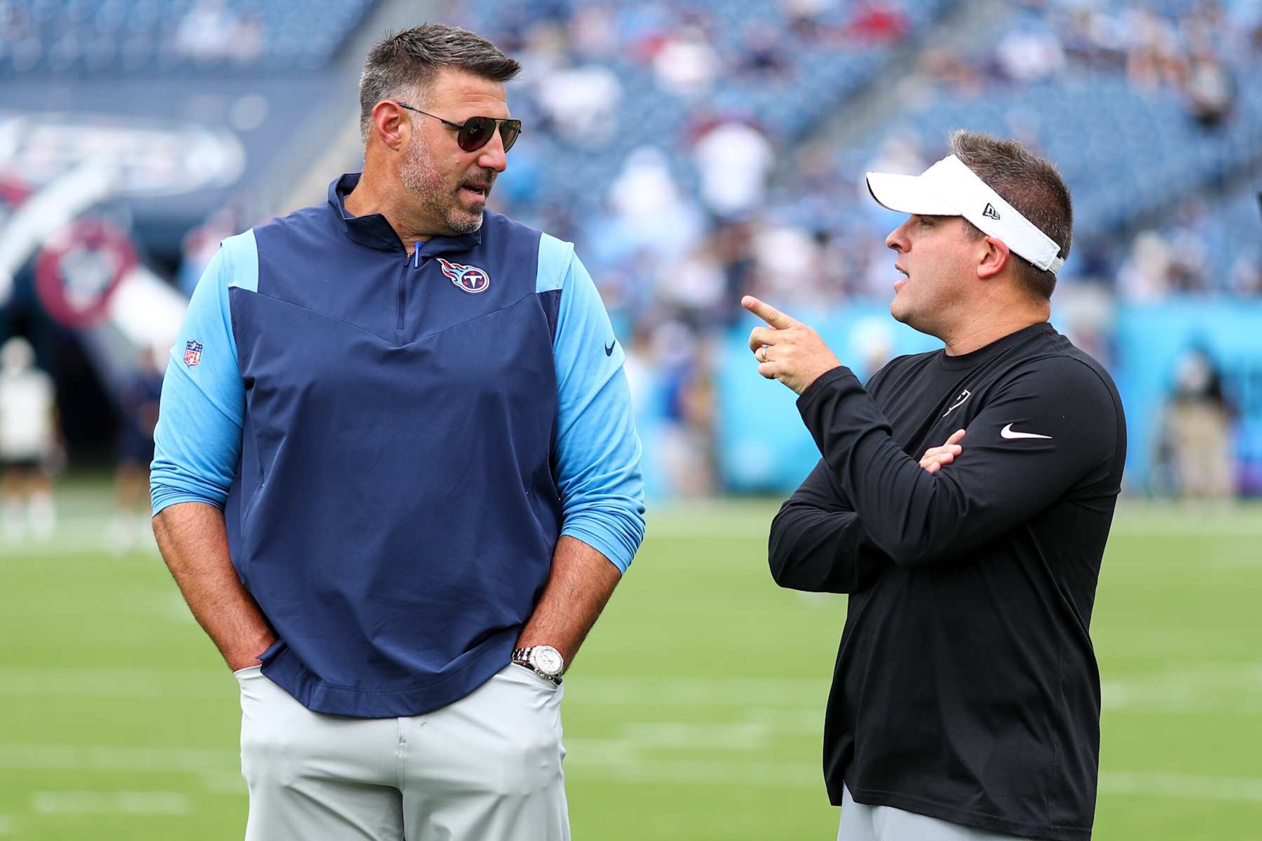 NASHVILLE, TN - SEPTEMBER 25: Head coach Mike Vrabel of the Tennessee Titans talks with head coach Josh McDaniels of the Las Vegas Raiders prior to an NFL football game at Nissan Stadium on September 25, 2022 in Nashville, Tennessee. (Photo by Kevin Sabitus/Getty Images) NASHVILLE, TN - SEPTEMBER 25: Head coach Mike Vrabel of the Tennessee Titans talks with head coach Josh McDaniels of the Las Vegas Raiders prior to an NFL football game at Nissan Stadium on September 25, 2022 in Nashville, Tennessee. (Photo by Kevin Sabitus/Getty Images)