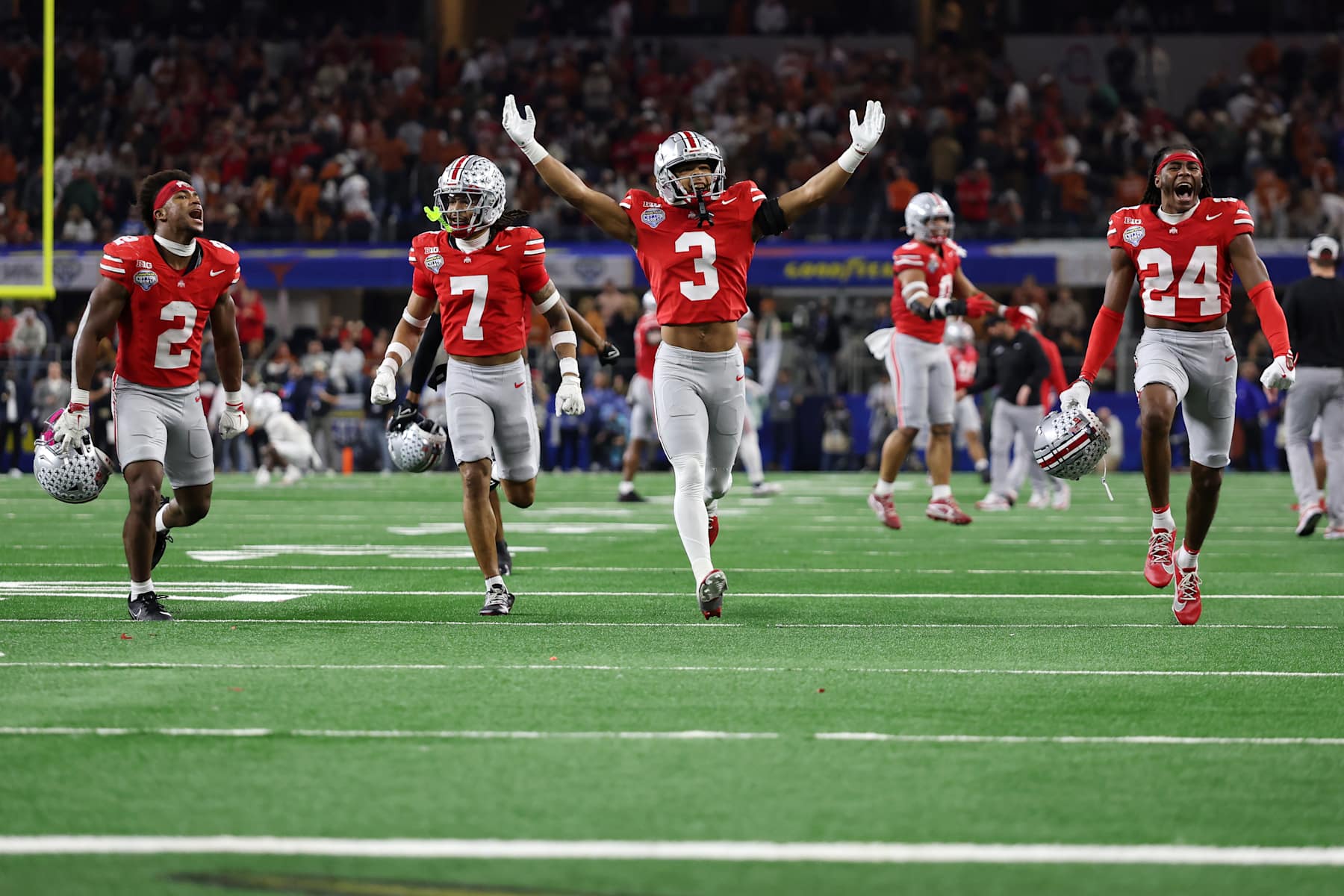 ARLINGTON, TEXAS - JANUARY 10: Members of the Ohio State Buckeyes defense celebrate in the fourth quarter against the Texas Longhorns during the Goodyear Cotton Bowl at AT&T Stadium on January 10, 2025 in Arlington, Texas. (Photo by Jamie Squire/Getty Images)