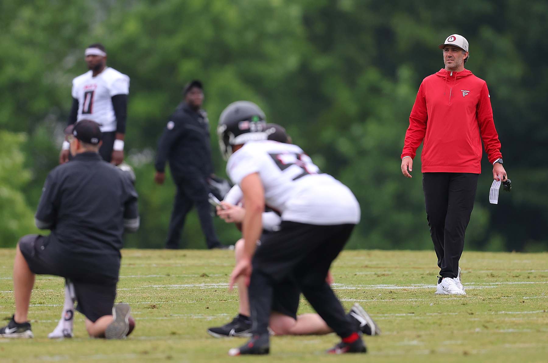 FLOWERY BRANCH, GEORGIA - MAY 14:  Offensive coordinator Zac Robinson of the Atlanta Falcons looks on during OTA offseason workouts at the Atlanta Falcons training facility on May 14, 2024 in Flowery Branch, Georgia. (Photo by Kevin C. Cox/Getty Images)