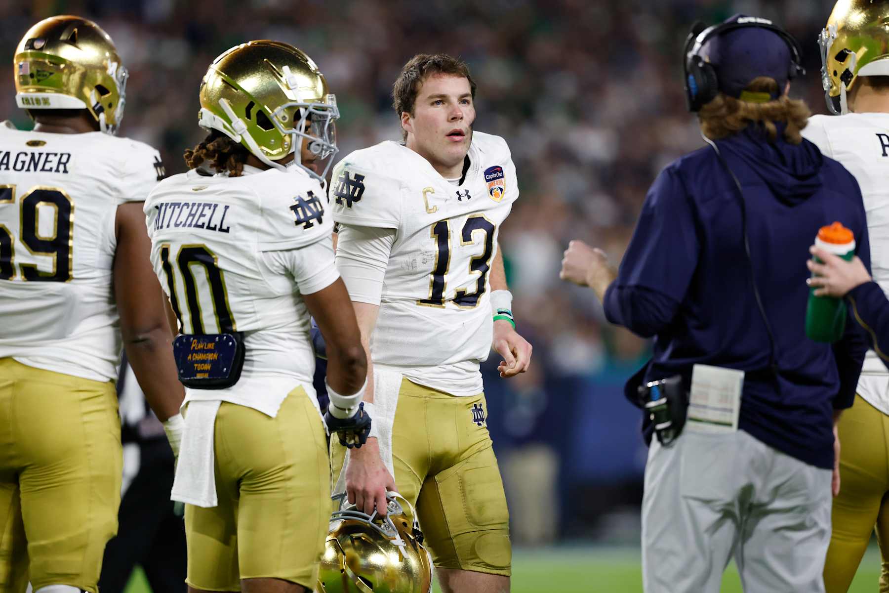 MIAMI GARDENS, FL - JANUARY 09: Quarterback Riley Leonard #13 of the Notre Dame Fighting Irish looks to the sideline during the Penn State Nittany Lions versus Notre Dame Fighting Irish College Football Playoff Semifinal at the Capital One Orange Bowl on January 9, 2025, at Hard Rock Stadium in Miami Gardens, Florida. (Photo by Joe Robbins/Icon Sportswire via Getty Images)