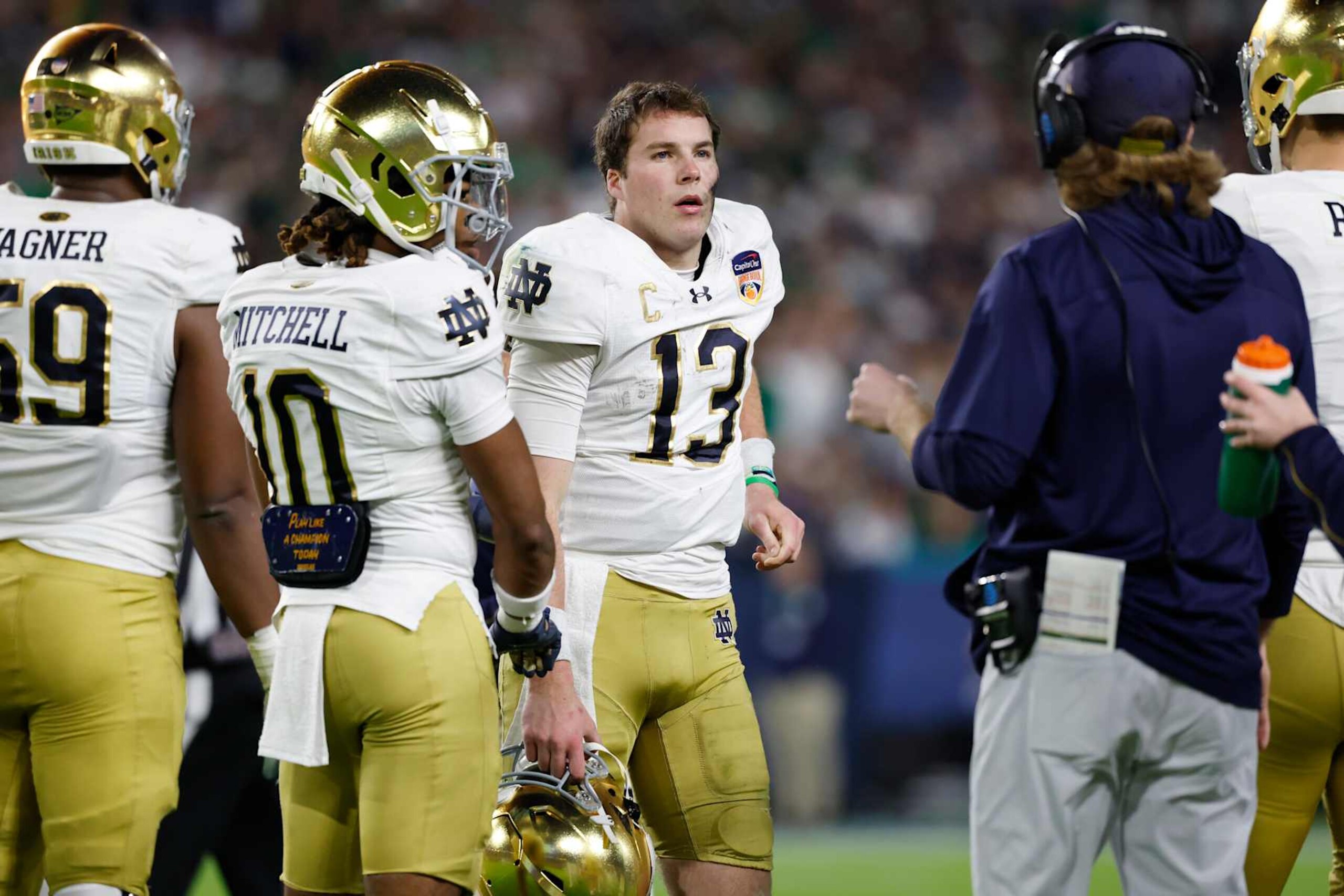 MIAMI GARDENS, FL - JANUARY 09: Quarterback Riley Leonard #13 of the Notre Dame Fighting Irish looks to the sideline during the Penn State Nittany Lions versus Notre Dame Fighting Irish College Football Playoff Semifinal at the Capital One Orange Bowl on January 9, 2025, at Hard Rock Stadium in Miami Gardens, Florida. (Photo by Joe Robbins/Icon Sportswire via Getty Images) MIAMI GARDENS, FL - JANUARY 09: Quarterback Riley Leonard #13 of the Notre Dame Fighting Irish looks to the sideline during the Penn State Nittany Lions versus Notre Dame Fighting Irish College Football Playoff Semifinal at the Capital One Orange Bowl on January 9, 2025, at Hard Rock Stadium in Miami Gardens, Florida. (Photo by Joe Robbins/Icon Sportswire via Getty Images)