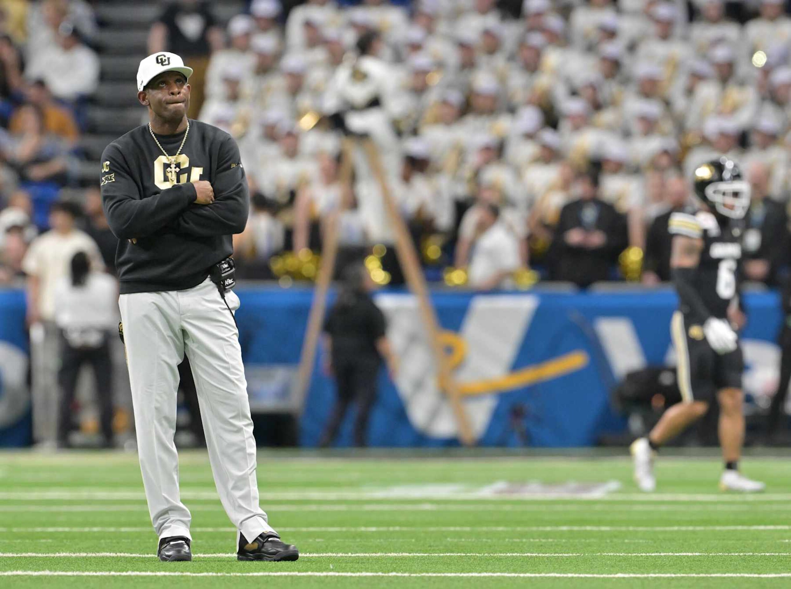 SAN ANTONIO, TEXAS - DECEMBER 28: Colorado Buffaloes head coach Deion Sanders watches a replay after Brigham Young Cougars wide receiver Parker Kingston (11) ran back a punt for a touchdown at the Alamodome in San Antonio, Texas on December 28, 2024. The Colorado Buffaloes played the Brigham Young Cougars in the Valero Alamo Bowl. (Photo by RJ Sangosti/MediaNews Group/The Denver Post via Getty Images) SAN ANTONIO, TEXAS - DECEMBER 28: Colorado Buffaloes head coach Deion Sanders watches a replay after Brigham Young Cougars wide receiver Parker Kingston (11) ran back a punt for a touchdown at the Alamodome in San Antonio, Texas on December 28, 2024. The Colorado Buffaloes played the Brigham Young Cougars in the Valero Alamo Bowl. (Photo by RJ Sangosti/MediaNews Group/The Denver Post via Getty Images)