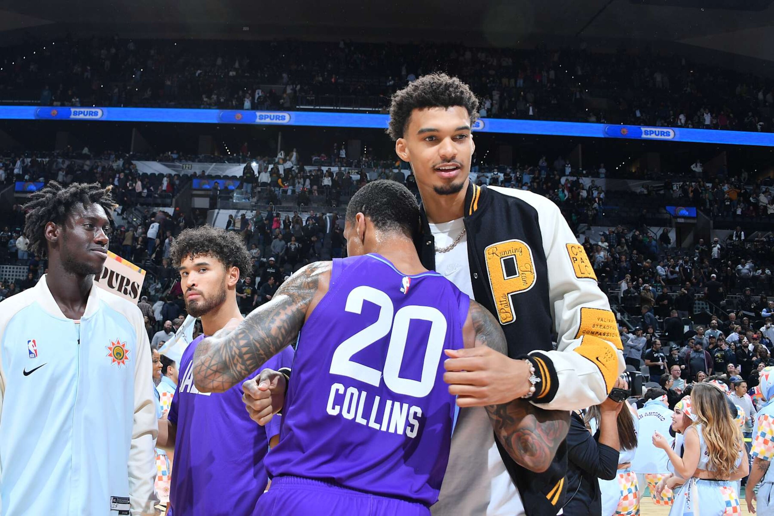 SAN ANTONIO, TX - NOVEMBER 21: John Collins #20 of the Utah Jazz and Victor Wembanyama #1 of the San Antonio Spurs embrace after the game on November 21, 2024 at the Frost Bank Center in San Antonio, Texas. NOTE TO USER: User expressly acknowledges and agrees that, by downloading and or using this photograph, user is consenting to the terms and conditions of the Getty Images License Agreement. Mandatory Copyright Notice: Copyright 2024 NBAE (Photos by Michael Gonzales/NBAE via Getty Images) SAN ANTONIO, TX - NOVEMBER 21: John Collins #20 of the Utah Jazz and Victor Wembanyama #1 of the San Antonio Spurs embrace after the game on November 21, 2024 at the Frost Bank Center in San Antonio, Texas. NOTE TO USER: User expressly acknowledges and agrees that, by downloading and or using this photograph, user is consenting to the terms and conditions of the Getty Images License Agreement. Mandatory Copyright Notice: Copyright 2024 NBAE (Photos by Michael Gonzales/NBAE via Getty Images)