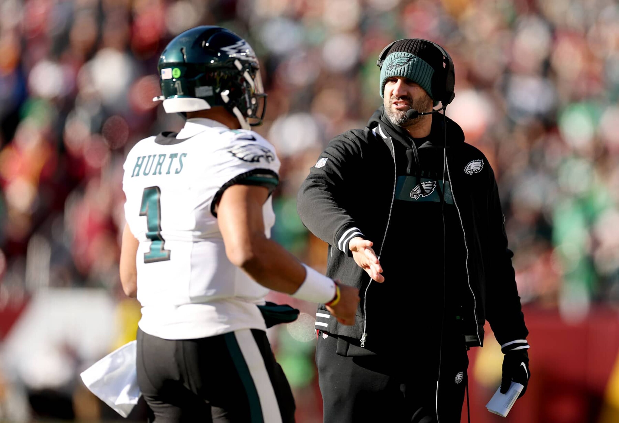LANDOVER, MARYLAND - DECEMBER 22: Jalen Hurts #1 of the Philadelphia Eagles is congratulated by head coach Nick Sirianni after a first quarter touchdown against the Washington Commanders at Northwest Stadium on December 22, 2024 in Landover, Maryland. (Photo by Scott Taetsch/Getty Images) LANDOVER, MARYLAND - DECEMBER 22: Jalen Hurts #1 of the Philadelphia Eagles is congratulated by head coach Nick Sirianni after a first quarter touchdown against the Washington Commanders at Northwest Stadium on December 22, 2024 in Landover, Maryland. (Photo by Scott Taetsch/Getty Images)
