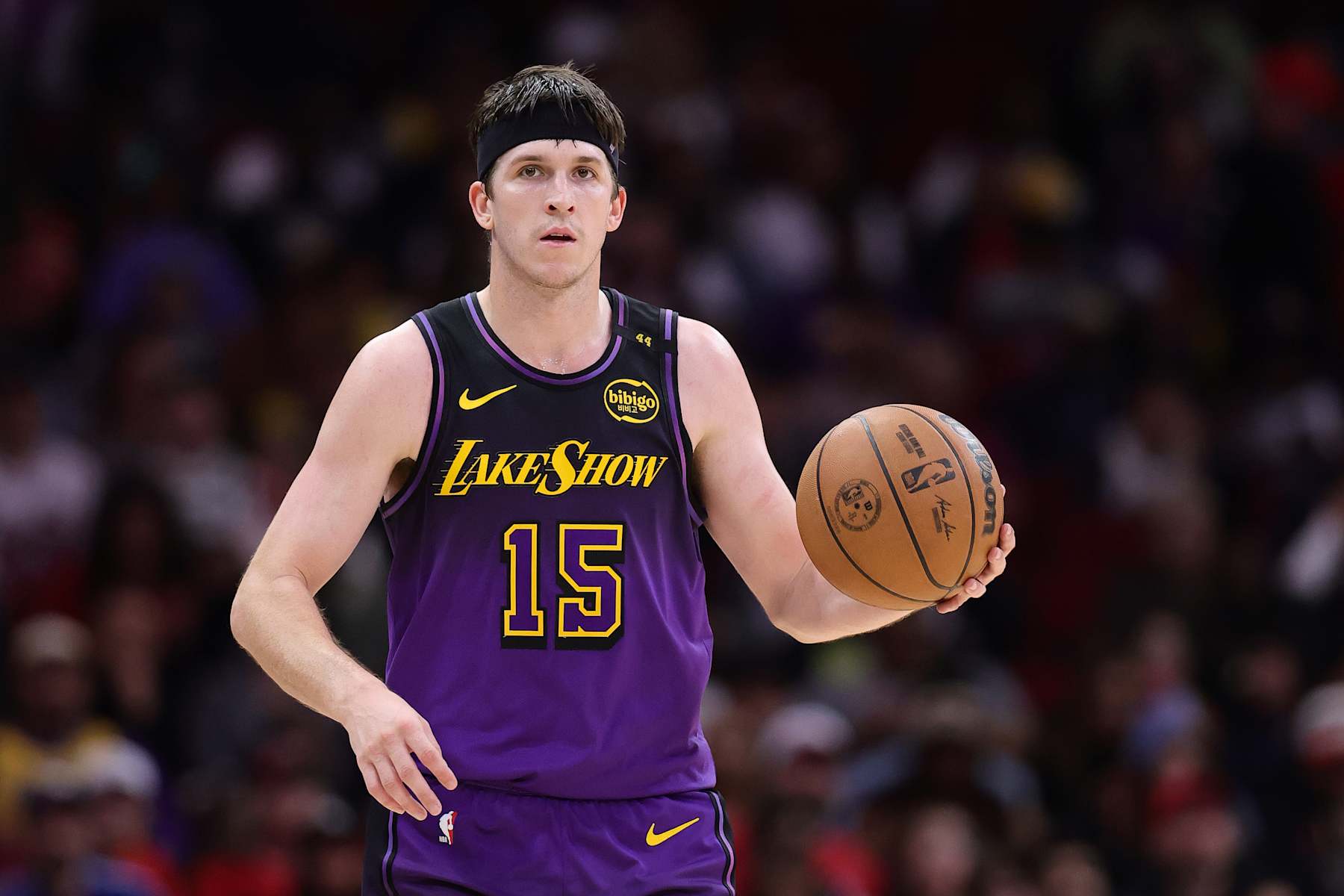 HOUSTON, TEXAS - JANUARY 05: Austin Reaves #15 of the Los Angeles Lakers dribbles against the Houston Rockets during the first half at Toyota Center on January 05, 2025 in Houston, Texas. NOTE TO USER: User expressly acknowledges and agrees that, by downloading and or using this photograph, User is consenting to the terms and conditions of the Getty Images License Agreement.  (Photo by Alex Slitz/Getty Images)