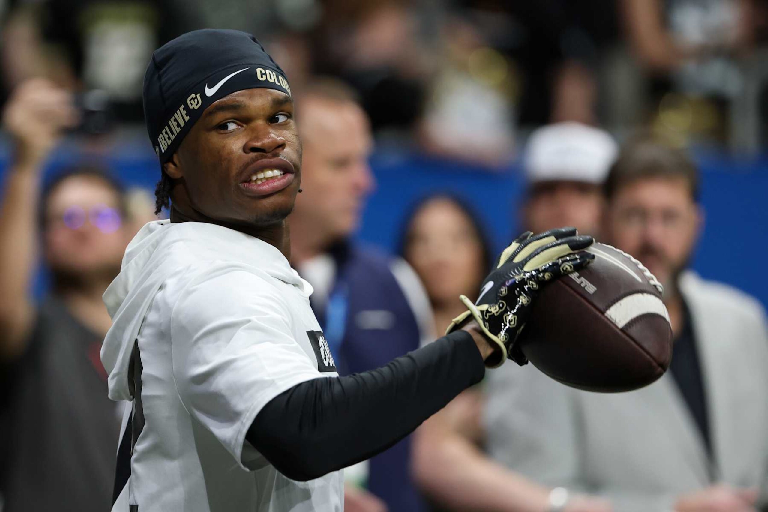 SAN ANTONIO, TX - DECEMBER 28: Colorado Buffaloes wide receiver Travis Hunter (12) holds a ball after practicing one-handed catches before the football game between BYU Cougars and Colorado Buffalos on December 28, 2024, at the Alamodome in San Antonio, Texas. (Photo by David Buono/Icon Sportswire via Getty Images) SAN ANTONIO, TX - DECEMBER 28: Colorado Buffaloes wide receiver Travis Hunter (12) holds a ball after practicing one-handed catches before the football game between BYU Cougars and Colorado Buffalos on December 28, 2024, at the Alamodome in San Antonio, Texas. (Photo by David Buono/Icon Sportswire via Getty Images)