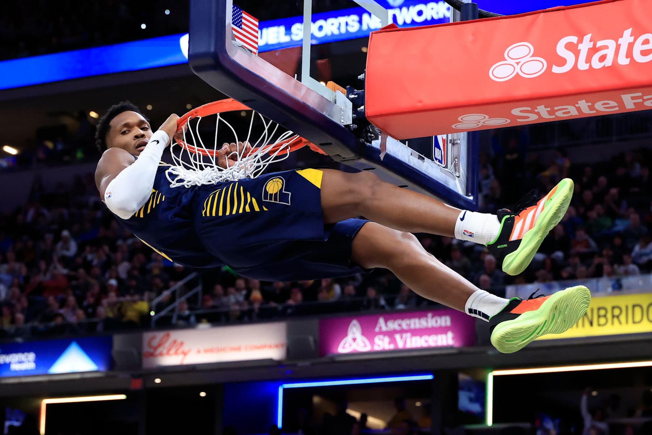 INDIANAPOLIS, INDIANA - JANUARY 14: Bennedict Mathurin #00 of the Indiana Pacers hangs on the rim after a dunk against the Cleveland Cavaliers during the first half at Gainbridge Fieldhouse on January 14, 2025 in Indianapolis, Indiana. NOTE TO USER: User expressly acknowledges and agrees that, by downloading and or using this photograph, User is consenting to the terms and conditions of the Getty Images License Agreement. (Photo by Justin Casterline/Getty Images) INDIANAPOLIS, INDIANA - JANUARY 14: Bennedict Mathurin #00 of the Indiana Pacers hangs on the rim after a dunk against the Cleveland Cavaliers during the first half at Gainbridge Fieldhouse on January 14, 2025 in Indianapolis, Indiana. NOTE TO USER: User expressly acknowledges and agrees that, by downloading and or using this photograph, User is consenting to the terms and conditions of the Getty Images License Agreement. (Photo by Justin Casterline/Getty Images)