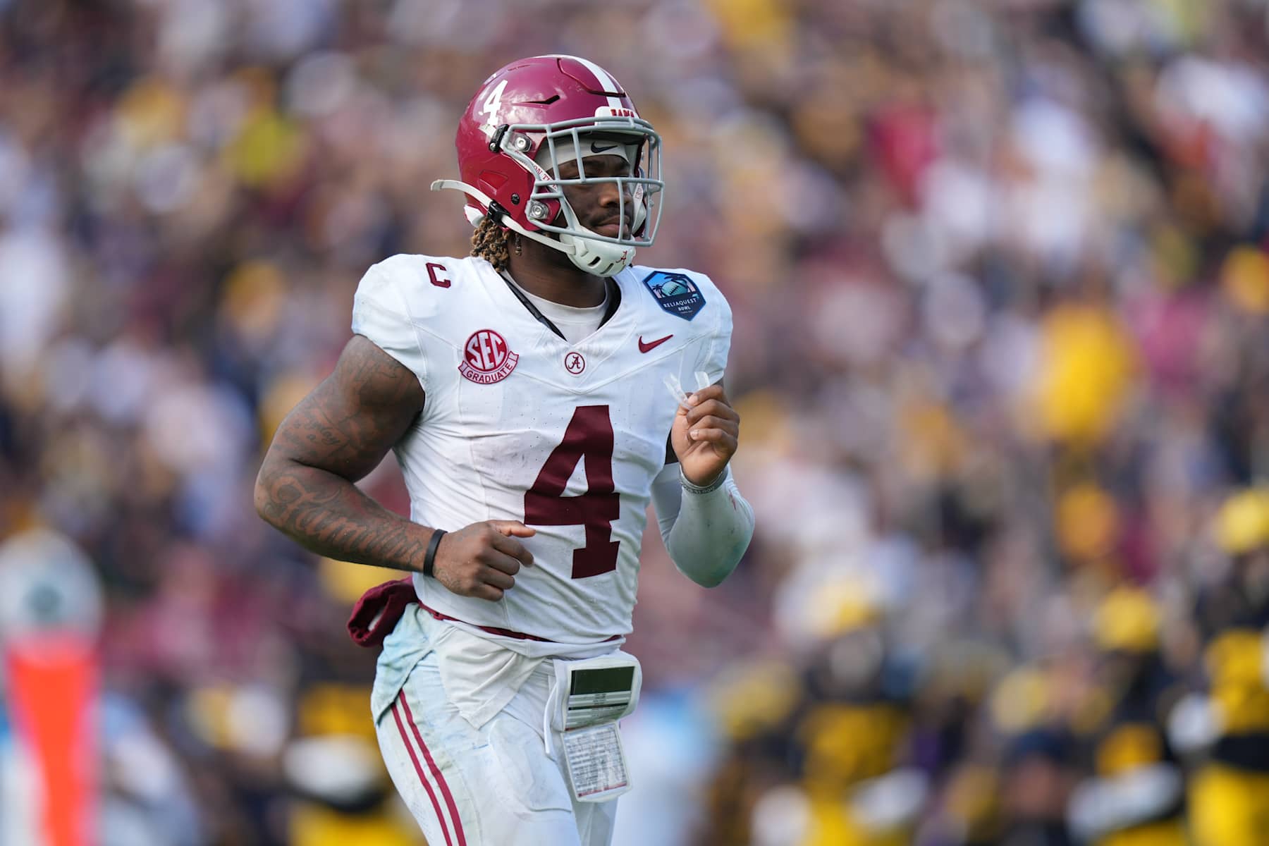 TAMPA, FL - DECEMBER 31: Alabama Crimson Tide quarterback Jalen Milroe (4) jogs to the sidelines during the ReliaQuest Bowl game between the Michigan Wolverines and the Alabama Crimson Tide on Tuesday, December 31, 2024 at Raymond James Stadium in Tampa, Fla. (Photo by Peter Joneleit/Icon Sportswire via Getty Images)