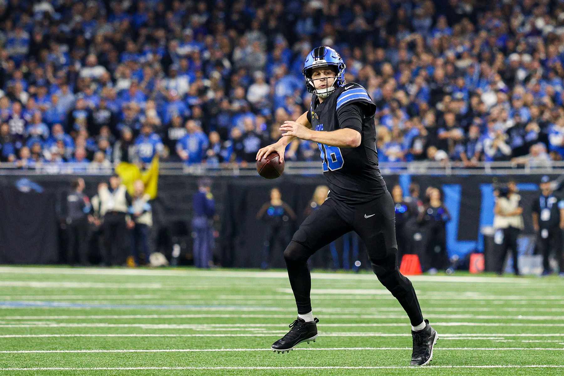 DETROIT, MICHIGAN - JANUARY 05: Jared Goff #16 of the Detroit Lions looks to throw a pass in the fourth quarter of a game against the Minnesota Vikings at Ford Field on January 05, 2025 in Detroit, Michigan. (Photo by Mike Mulholland/Getty Images)