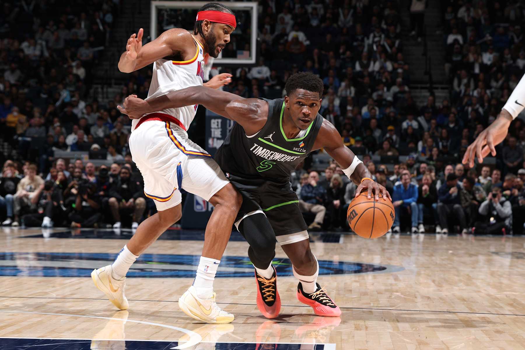 MINNEAPOLIS, MN -  JANUARY 15: Anthony Edwards #5 of the Minnesota Timberwolves handles the ball during the game against the Golden State Warriors on January 15, 2025 at Target Center in Minneapolis, Minnesota. NOTE TO USER: User expressly acknowledges and agrees that, by downloading and or using this Photograph, user is consenting to the terms and conditions of the Getty Images License Agreement. Mandatory Copyright Notice: Copyright 2025 NBAE (Photo by David Sherman/NBAE via Getty Images)