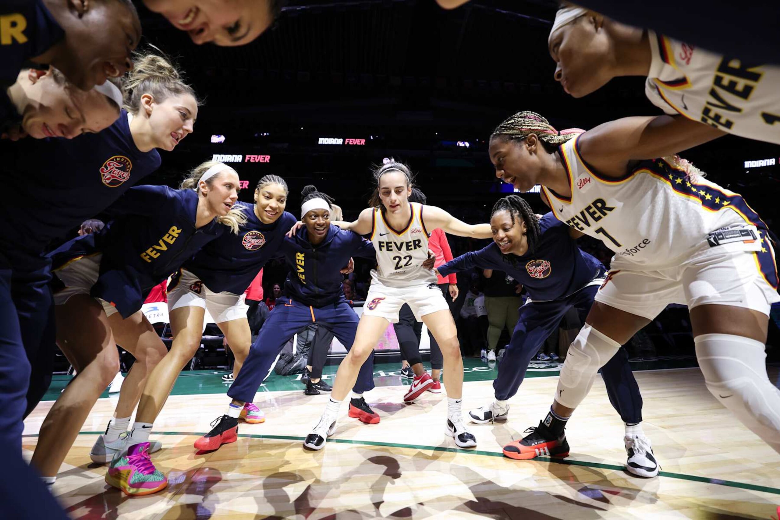 SEATTLE, WASHINGTON - MAY 22: Caitlin Clark #22 of the Indiana Fever huddles with teammates prior to a game \asea in the game at Climate Pledge Arena on May 22, 2024 in Seattle, Washington. NOTE TO USER: User expressly acknowledges and agrees that, by downloading and or using this photograph, User is consenting to the terms and conditions of the Getty Images License Agreement. (Photo by Steph Chambers/Getty Images) SEATTLE, WASHINGTON - MAY 22: Caitlin Clark #22 of the Indiana Fever huddles with teammates prior to a game \asea in the game at Climate Pledge Arena on May 22, 2024 in Seattle, Washington. NOTE TO USER: User expressly acknowledges and agrees that, by downloading and or using this photograph, User is consenting to the terms and conditions of the Getty Images License Agreement. (Photo by Steph Chambers/Getty Images)
