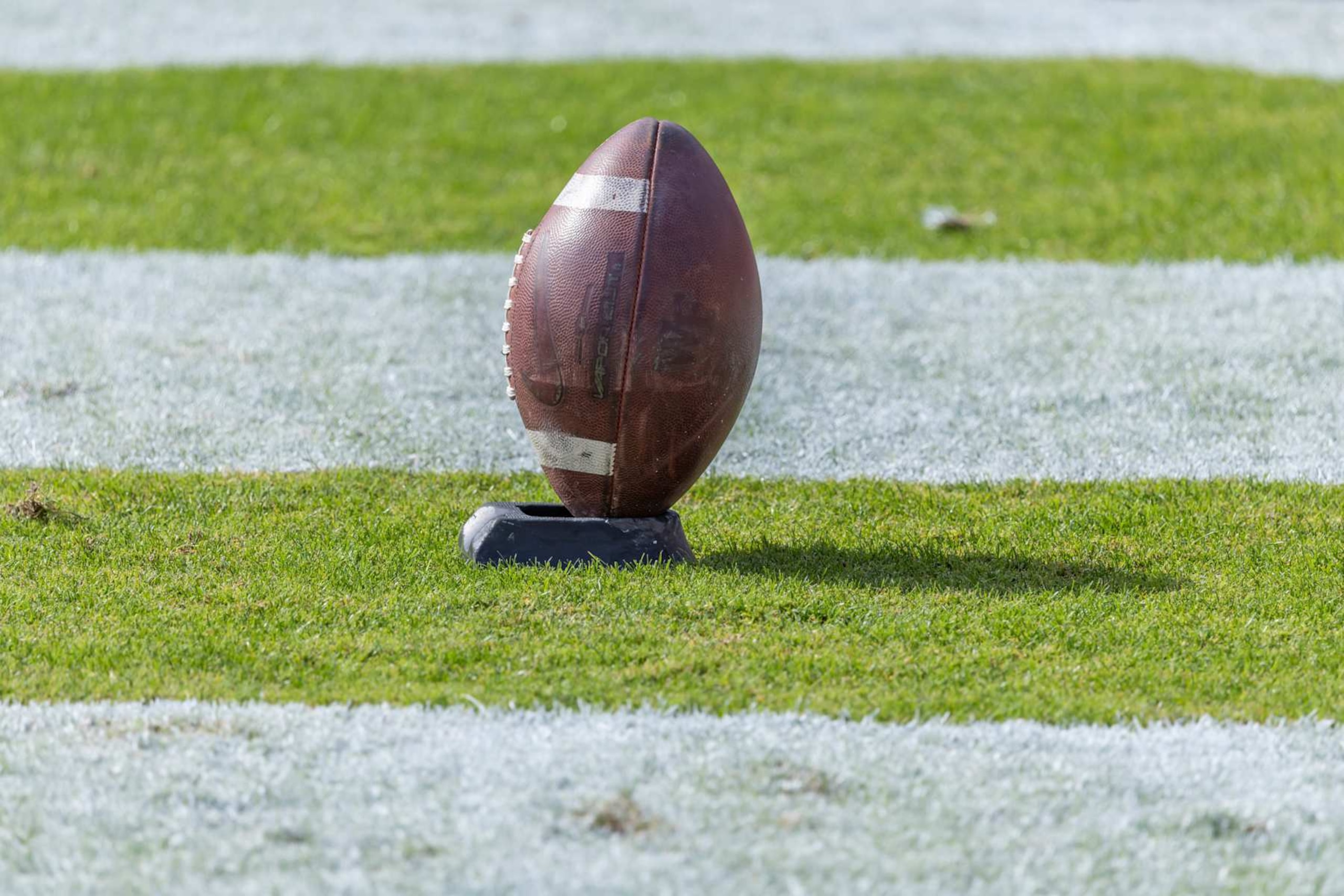 PALO ALTO, CA - OCTOBER 26: A closeup view of an American football on a kicking tee before an ACC college football game between the Stanford Cardinal and the Wake Forest Demon Deacons on October 26, 2024 at Stanford Stadium in Palo Alto, California. (Photo by David Madison/Getty Images) PALO ALTO, CA - OCTOBER 26: A closeup view of an American football on a kicking tee before an ACC college football game between the Stanford Cardinal and the Wake Forest Demon Deacons on October 26, 2024 at Stanford Stadium in Palo Alto, California. (Photo by David Madison/Getty Images)