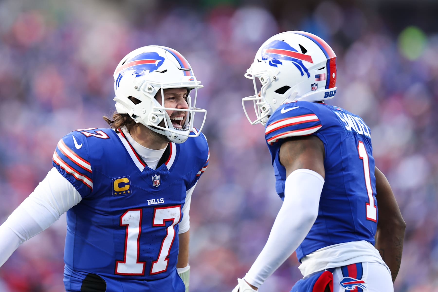 ORCHARD PARK, NEW YORK - JANUARY 12: Josh Allen #17 of the Buffalo Bills celebrates with Curtis Samuel #1 of the Buffalo Bills after a touchdown is scored during the fourth quarter against the Denver Broncos at Highmark Stadium on January 12, 2025 in Orchard Park, New York. (Photo by Kathryn Riley/Getty Images)
