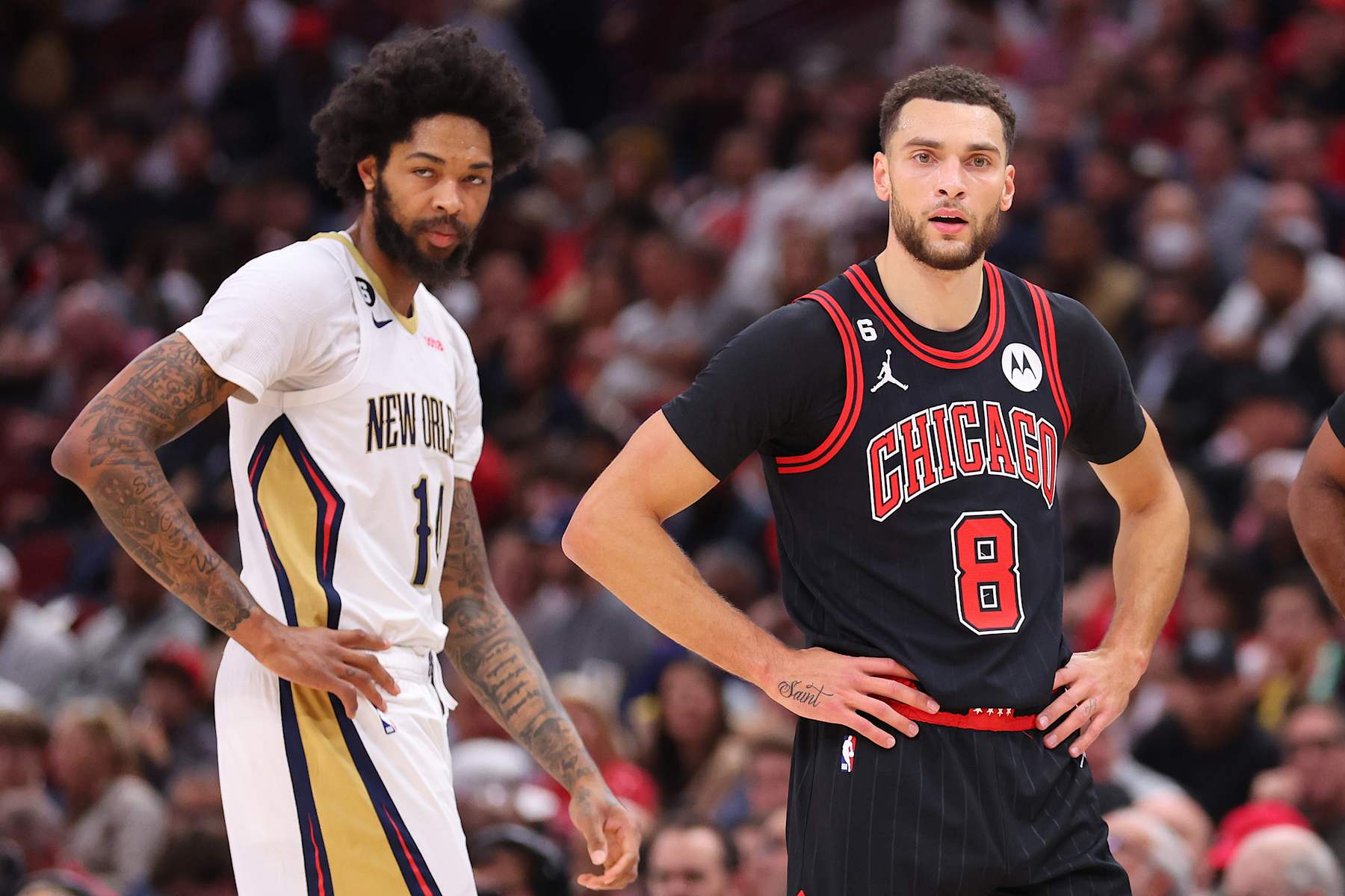 CHICAGO, ILLINOIS - NOVEMBER 09: Brandon Ingram #14 of the New Orleans Pelicans and Zach LaVine #8 of the Chicago Bulls look on during the first half at United Center on November 09, 2022 in Chicago, Illinois. NOTE TO USER: User expressly acknowledges and agrees that, by downloading and or using this photograph, User is consenting to the terms and conditions of the Getty Images License Agreement.  (Photo by Michael Reaves/Getty Images)