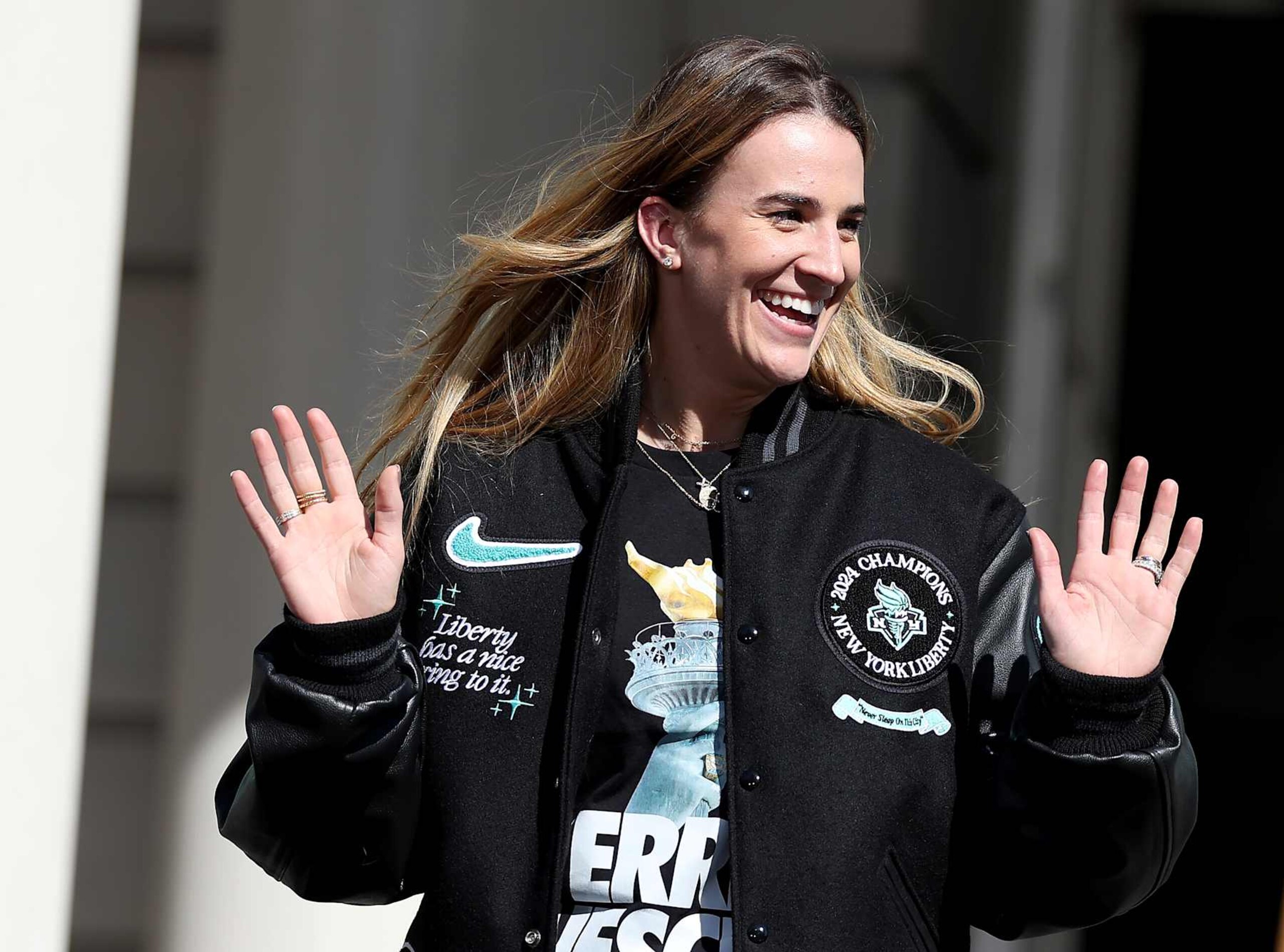 NEW YORK, NEW YORK - OCTOBER 24: Sabrina Ionescu #20 of the New York Liberty waves as she is announced during the Championship ticker tape parade and victory rally celebrating winning the 2024 WNBA Finals on October 24, 2024 in New York City. NOTE TO USER: User expressly acknowledges and agrees that, by downloading and/or using this photograph, user is consenting to the terms and conditions of the Getty Images License Agreement. (Photo by Elsa/Getty Images) NEW YORK, NEW YORK - OCTOBER 24: Sabrina Ionescu #20 of the New York Liberty waves as she is announced during the Championship ticker tape parade and victory rally celebrating winning the 2024 WNBA Finals on October 24, 2024 in New York City. NOTE TO USER: User expressly acknowledges and agrees that, by downloading and/or using this photograph, user is consenting to the terms and conditions of the Getty Images License Agreement. (Photo by Elsa/Getty Images)