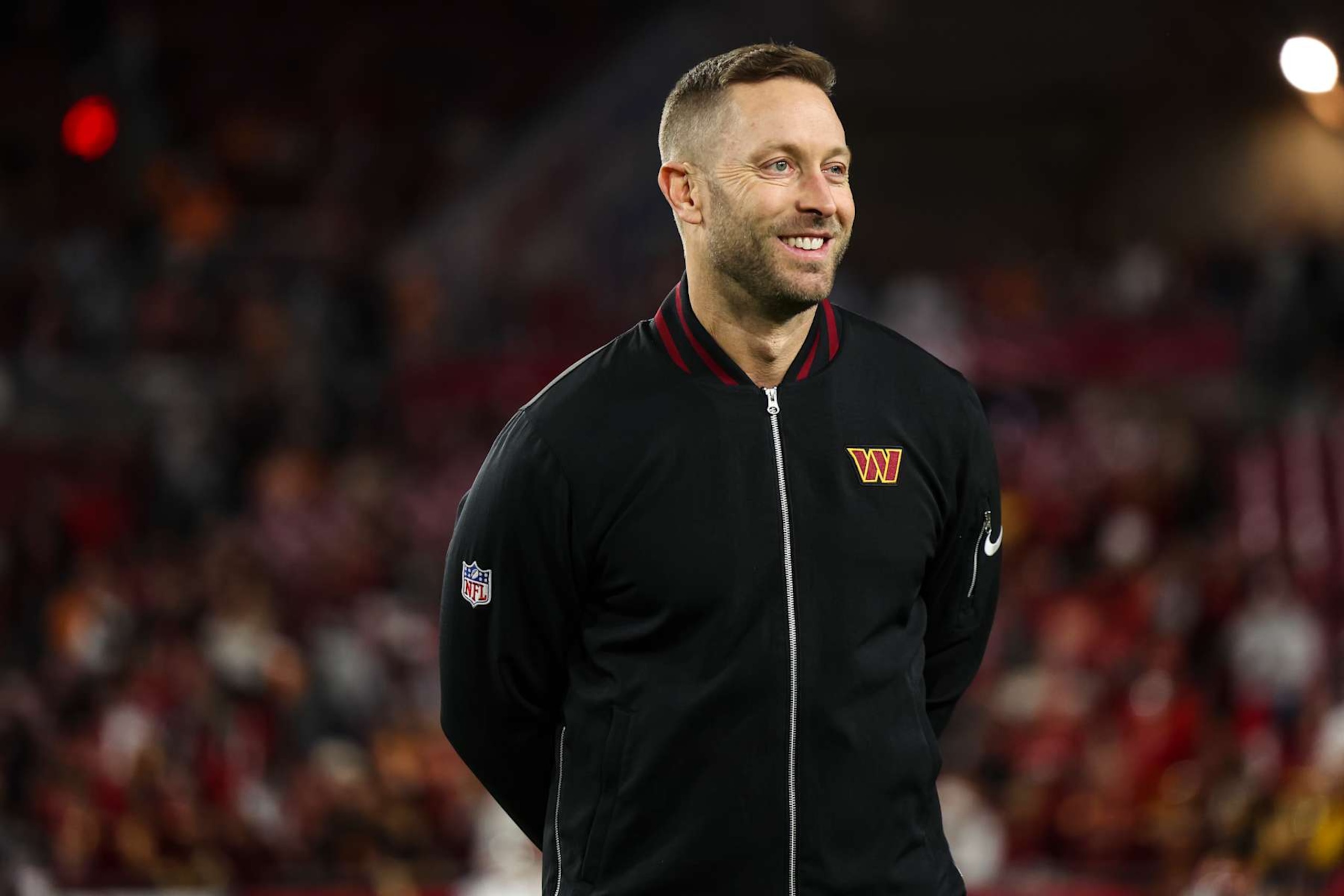 TAMPA, FLORIDA - JANUARY 12: Washington Commanders offensive coordinator Kliff Kingsbury looks on from the field prior to an NFL football wild card playoff game against the Tampa Bay Buccaneers at Raymond James Stadium on January 12, 2025 in Tampa, Florida. (Photo by Perry Knotts/Getty Images) TAMPA, FLORIDA - JANUARY 12: Washington Commanders offensive coordinator Kliff Kingsbury looks on from the field prior to an NFL football wild card playoff game against the Tampa Bay Buccaneers at Raymond James Stadium on January 12, 2025 in Tampa, Florida. (Photo by Perry Knotts/Getty Images)