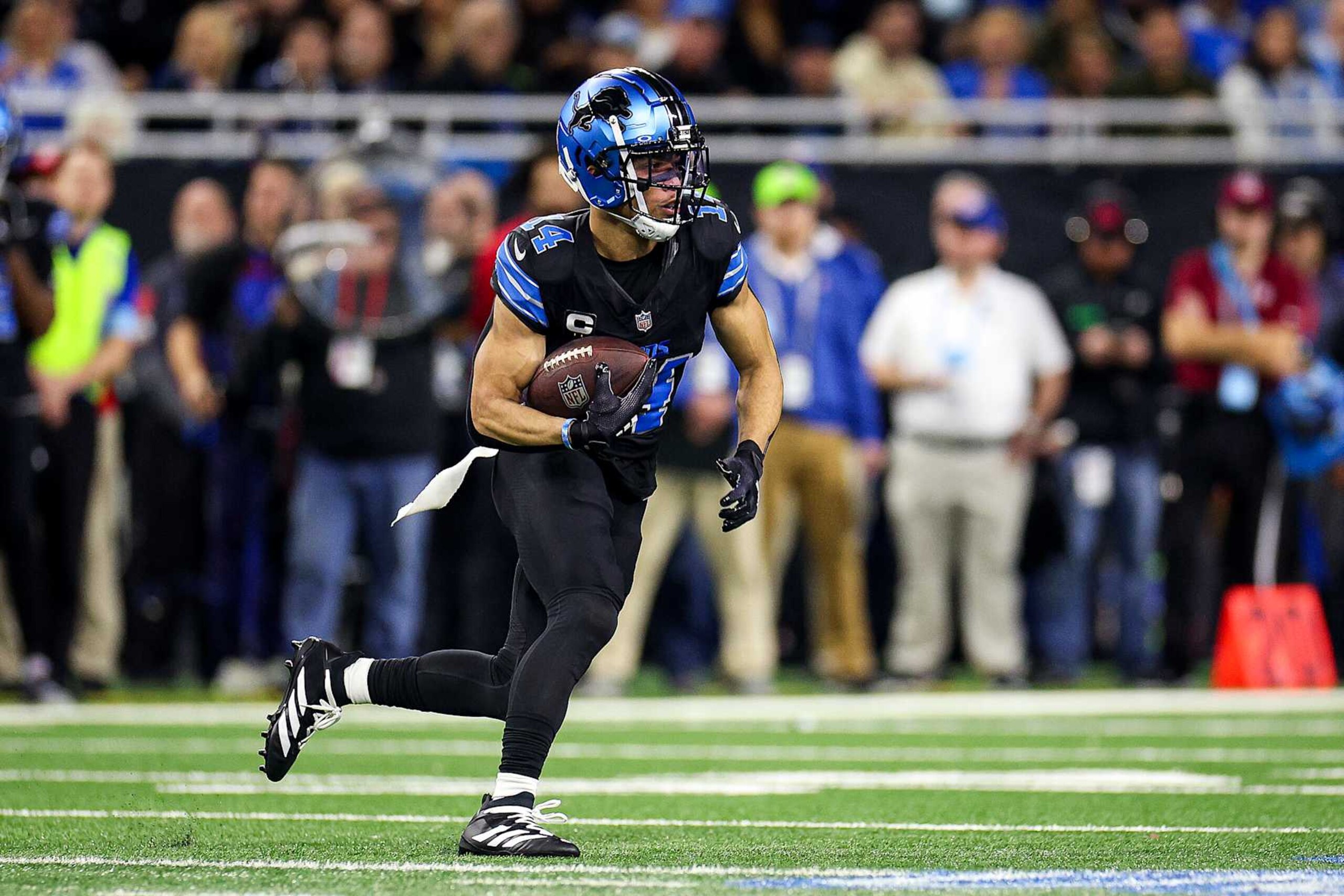 DETROIT, MICHIGAN - JANUARY 05: Amon-Ra St. Brown #14 of the Detroit Lions runs the ball up the field in the first quarter of a game against the Minnesota Vikings at Ford Field on January 05, 2025 in Detroit, Michigan. (Photo by Mike Mulholland/Getty Images) DETROIT, MICHIGAN - JANUARY 05: Amon-Ra St. Brown #14 of the Detroit Lions runs the ball up the field in the first quarter of a game against the Minnesota Vikings at Ford Field on January 05, 2025 in Detroit, Michigan. (Photo by Mike Mulholland/Getty Images)