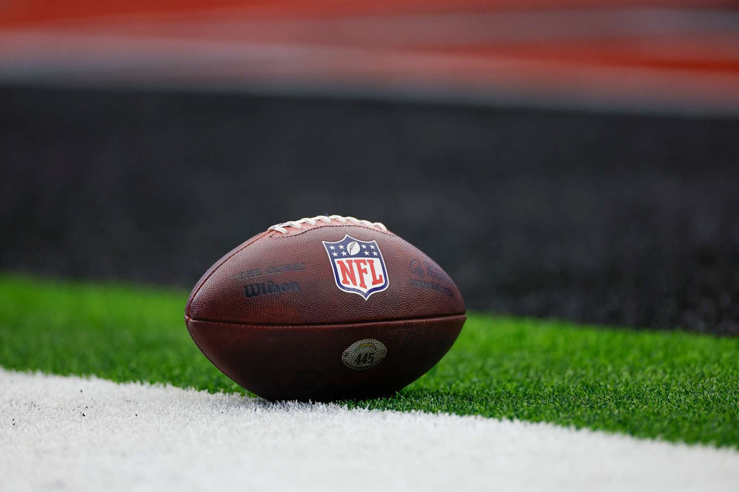 HOUSTON, TEXAS - JANUARY 11: The NFL Shield logo on the ball prior to the AFC Wild Card Playoff game between the Los Angeles Chargers and Houston Texans at NRG Stadium on January 11, 2025 in Houston, Texas. (Photo by Brandon Sloter/Getty Images) HOUSTON, TEXAS - JANUARY 11: The NFL Shield logo on the ball prior to the AFC Wild Card Playoff game between the Los Angeles Chargers and Houston Texans at NRG Stadium on January 11, 2025 in Houston, Texas. (Photo by Brandon Sloter/Getty Images)