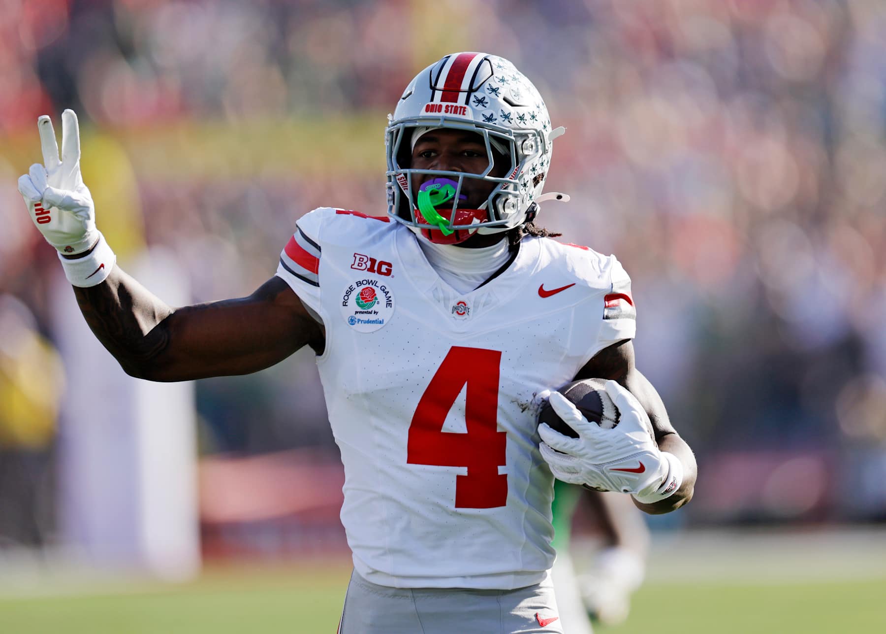 PASADENA, CALIFORNIA - JANUARY 1: Jeremiah Smith #4 of the Ohio State Buckeyes celebrates after scoring a touchdown against the Oregon Ducks during the first quarter during the Rose Bowl Game Presented by Prudential at Rose Bowl Stadium on January 1, 2025 in Pasadena, California. (Photo by Kevork Djansezian/Getty Images)