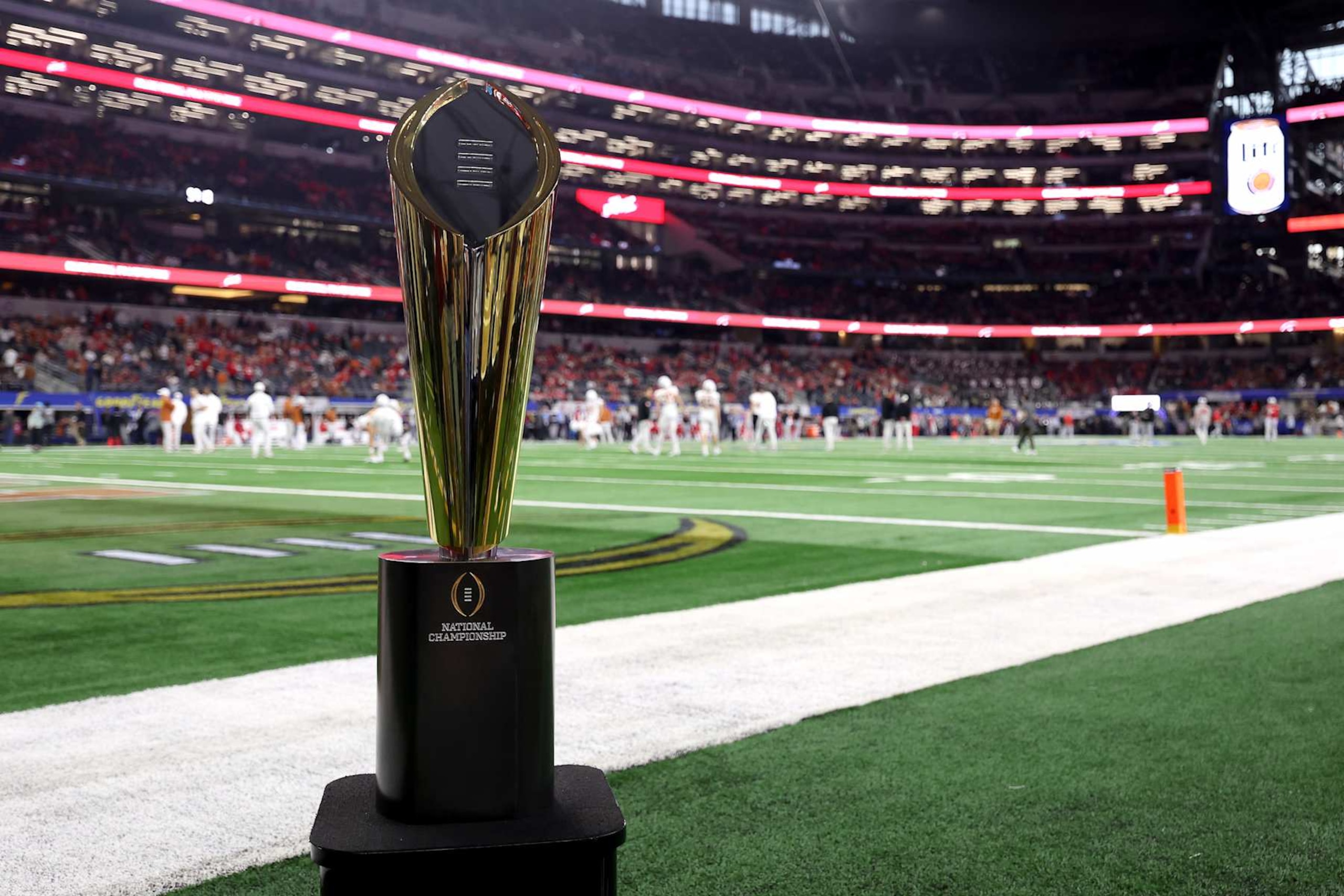 ARLINGTON, TEXAS - JANUARY 10: A general view of the College Football Playoff National Championship Trophy before the Goodyear Cotton Bowl between the Ohio State Buckeyes and the Texas Longhorns at AT&T Stadium on January 10, 2025 in Arlington, Texas. (Photo by Sam Hodde/Getty Images) ARLINGTON, TEXAS - JANUARY 10: A general view of the College Football Playoff National Championship Trophy before the Goodyear Cotton Bowl between the Ohio State Buckeyes and the Texas Longhorns at AT&T Stadium on January 10, 2025 in Arlington, Texas. (Photo by Sam Hodde/Getty Images)