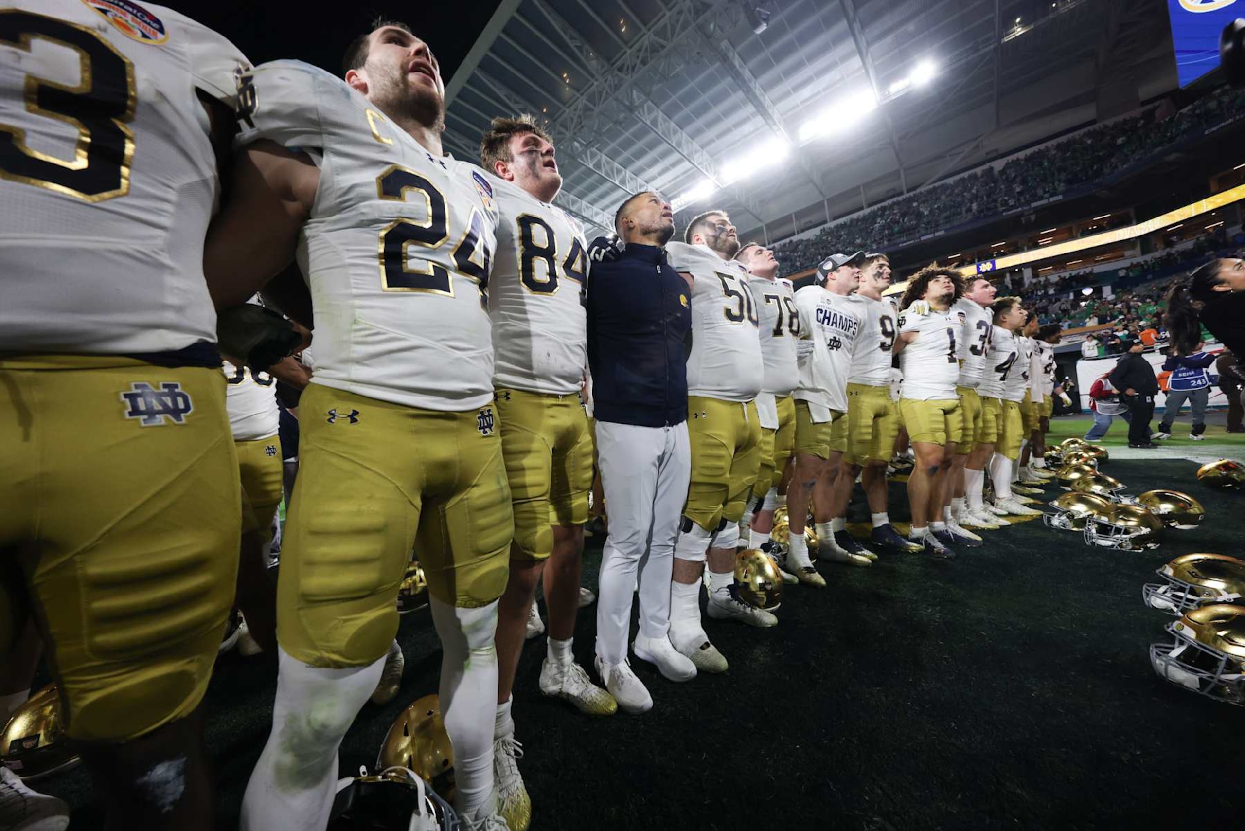 MIAMI GARDENS, FLORIDA - JANUARY 9: Head coach Marcus Freeman of the Notre Dame Fighting Irish sings the alma matter with his team after the 2025 Orange Bowl against the Penn State Nittany Lions at Hard Rock Stadium on January 9, 2025 in Miami Gardens, Florida. (Photo by CFP/Getty Images) MIAMI GARDENS, FLORIDA - JANUARY 9: Head coach Marcus Freeman of the Notre Dame Fighting Irish sings the alma matter with his team after the 2025 Orange Bowl against the Penn State Nittany Lions at Hard Rock Stadium on January 9, 2025 in Miami Gardens, Florida. (Photo by CFP/Getty Images)