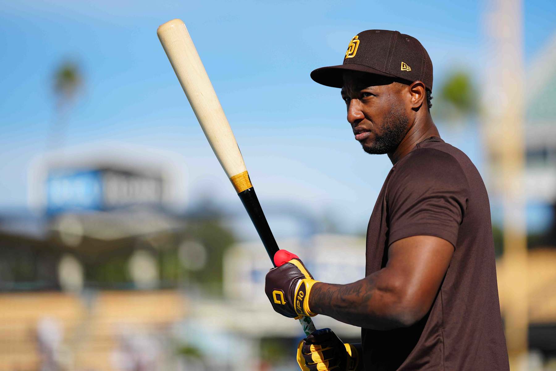 LOS ANGELES, CA - OCTOBER 11:   Jurickson Profar #10 of the San Diego Padres looks on during batting practice prior to Game 5 of the Division Series presented by Booking.com between the San Diego Padres and the Los Angeles Dodgers at Dodger Stadium on Friday, October 11, 2024 in Los Angeles, California. (Photo by Daniel Shirey/MLB Photos via Getty Images)