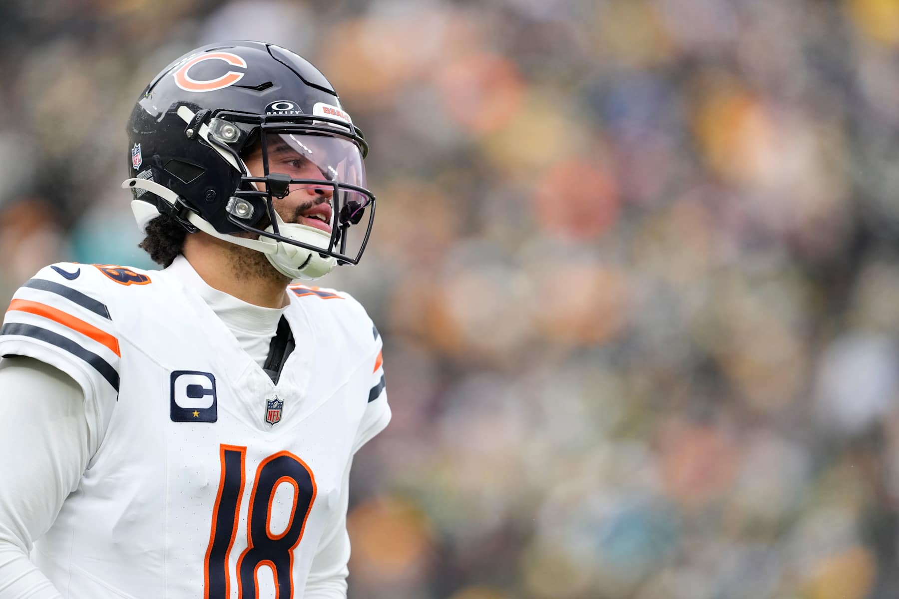 GREEN BAY, WISCONSIN - JANUARY 05: Caleb Williams #18 of the Chicago Bears looks on during the first quarter against the Green Bay Packers at Lambeau Field on January 05, 2025 in Green Bay, Wisconsin. (Photo by Patrick McDermott/Getty Images)