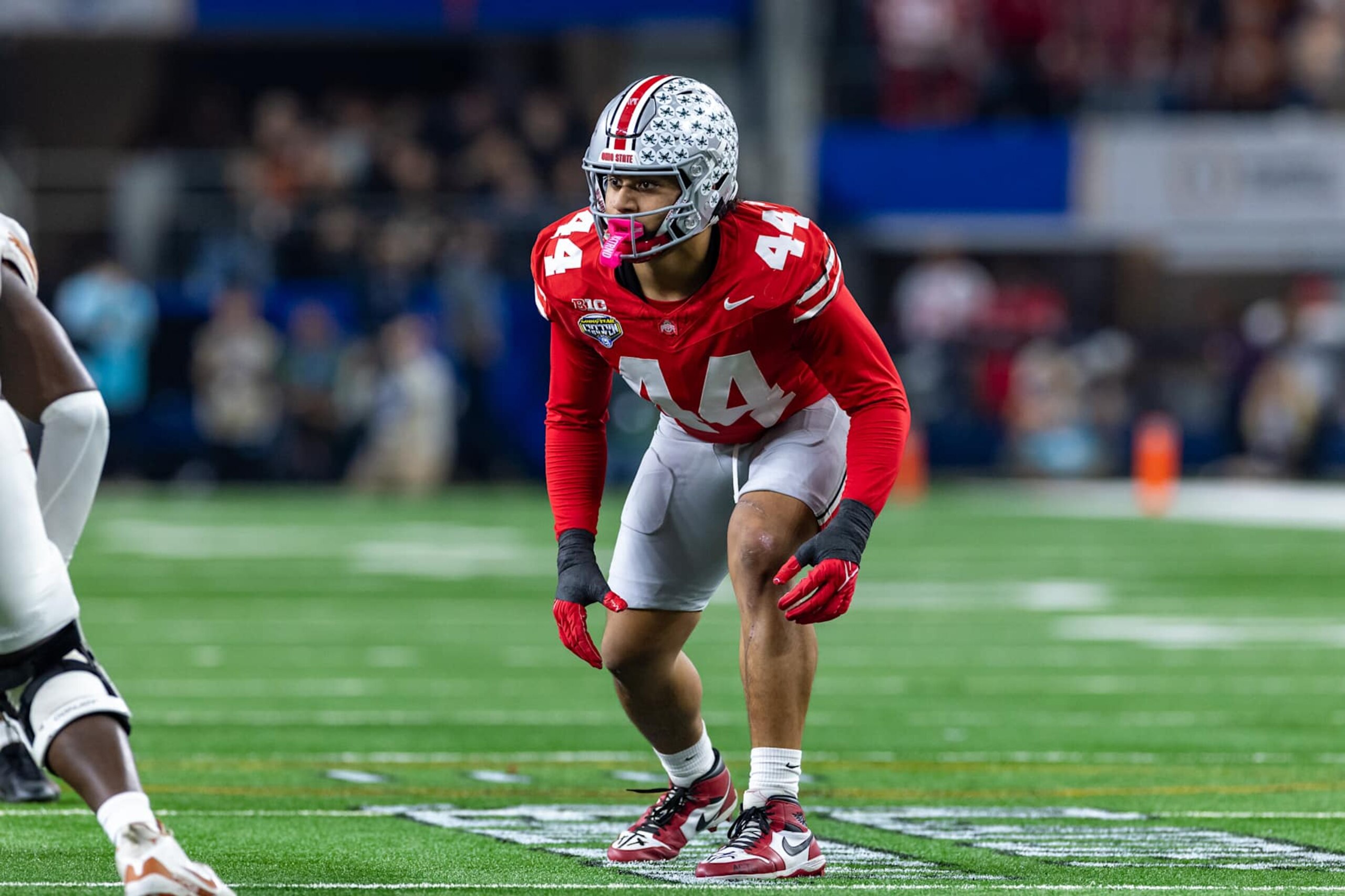 ARLINGTON, TX - JANUARY 10: Ohio State Buckeyes defensive end JT Tuimoloau (#44) lines up before the snap during the CFP Semifinal Cotton Bowl Classic football game between the Ohio State Buckeyes and Texas Longhorns on January 10, 2025 at AT&T Stadium in Arlington, TX. (Photo by Matthew Visinsky/Icon Sportswire via Getty Images) ARLINGTON, TX - JANUARY 10: Ohio State Buckeyes defensive end JT Tuimoloau (#44) lines up before the snap during the CFP Semifinal Cotton Bowl Classic football game between the Ohio State Buckeyes and Texas Longhorns on January 10, 2025 at AT&T Stadium in Arlington, TX. (Photo by Matthew Visinsky/Icon Sportswire via Getty Images)