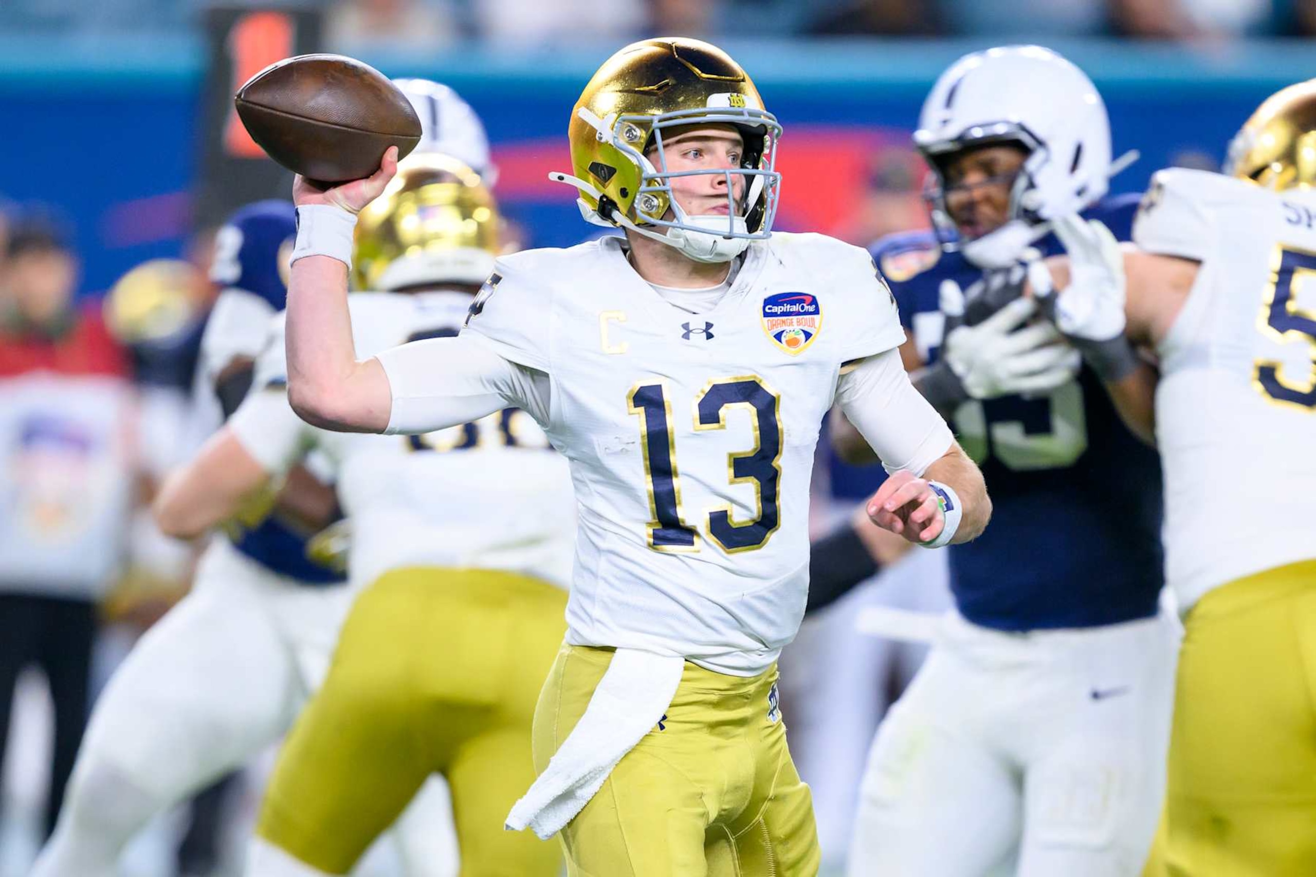 MIAMI GARDENS, FL - JANUARY 09: Quarterback Riley Leonard #13 of the Notre Dame Fighting Irish throws the ball during the Penn State Nittany Lions versus Notre Dame Fighting Irish College Football Playoff Semifinal at the Capital One Orange Bowl on January 9, 2025, at Hard Rock Stadium in Miami Gardens, FL. (Photo by Doug Murray/Icon Sportswire via Getty Images) MIAMI GARDENS, FL - JANUARY 09: Quarterback Riley Leonard #13 of the Notre Dame Fighting Irish throws the ball during the Penn State Nittany Lions versus Notre Dame Fighting Irish College Football Playoff Semifinal at the Capital One Orange Bowl on January 9, 2025, at Hard Rock Stadium in Miami Gardens, FL. (Photo by Doug Murray/Icon Sportswire via Getty Images)