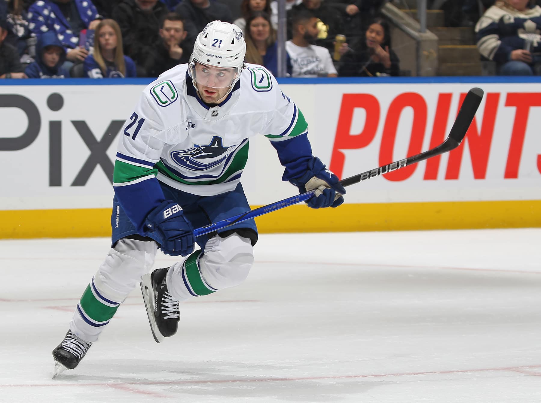 TORONTO, CANADA - JANUARY 11:  Nils Hoglander #21 of the Vancouver Canucks skates against the Toronto Maple Leafs during the first period in an NHL game at Scotiabank Arena on January 11, 2025 in Toronto, Ontario, Canada.  (Photo by Claus Andersen/Getty Images)