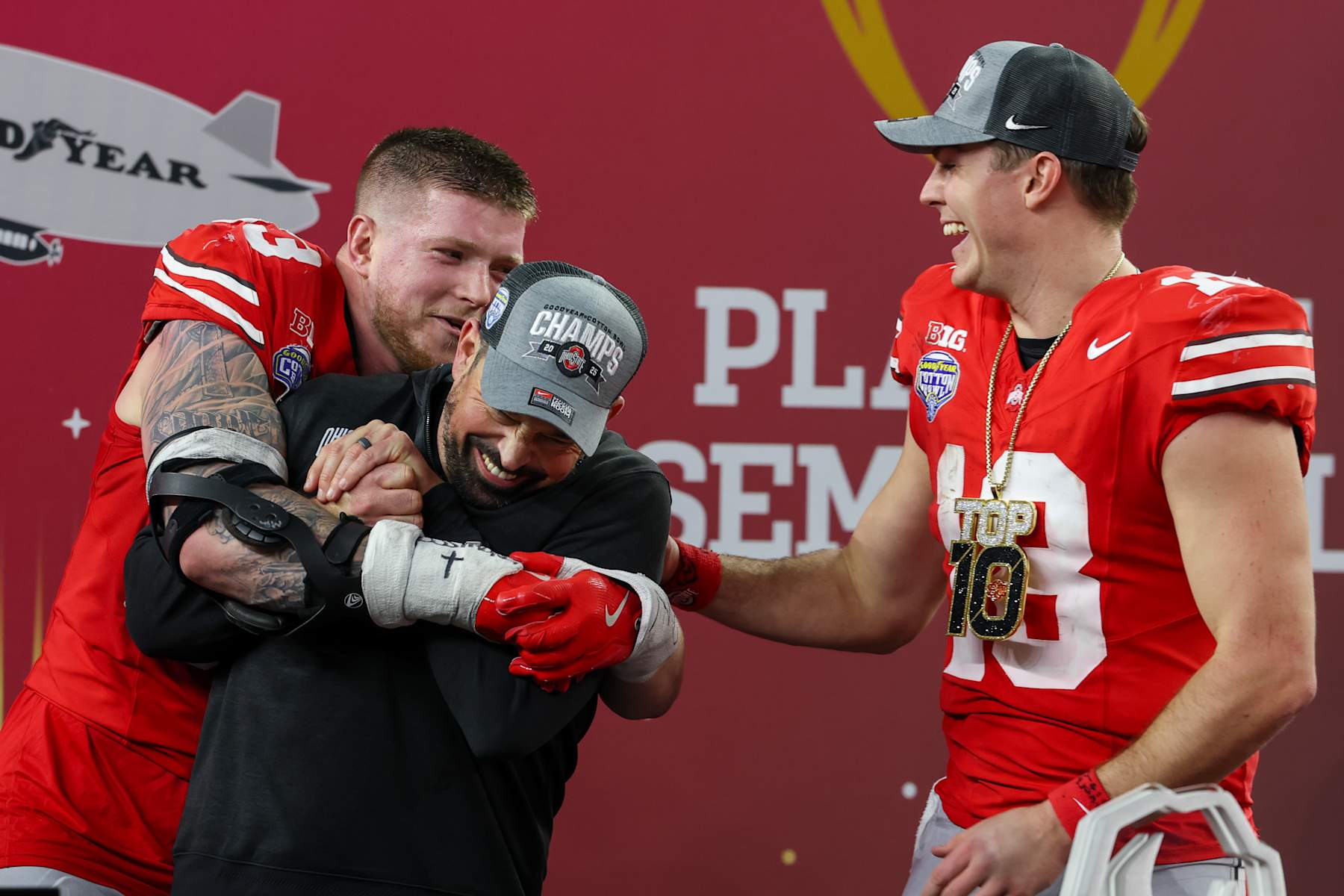 ARLINGTON, TX - JANUARY 10: Defensive End Jack Sawyer #33 of the Ohio State Buckeyes hugs Head Coach Ryan Day of the Ohio State Buckeyes after winning the Ohio State Buckeyes versus Texas Longhorns College Football Playoff Semifinal at the Cotton Bowl Classic on January 10, 2025, at AT&T Stadium in Arlington, TX. (Photo by David Buono/Icon Sportswire via Getty Images)