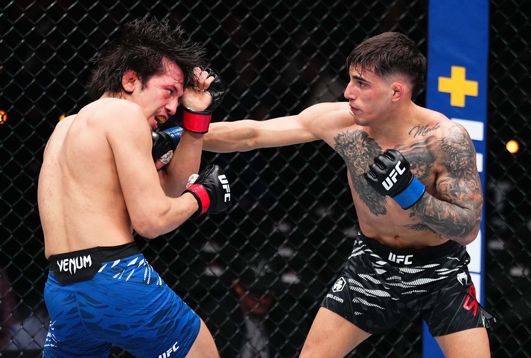 INGLEWOOD, CALIFORNIA - JANUARY 18: (R-L) Benardo Sopaj of Albania punches Ricky Turcios in a bantamweight fight during the UFC 311 event at Intuit Dome on January 18, 2025 in Inglewood, California. (Photo by Jeff Bottari/Zuffa LLC)
