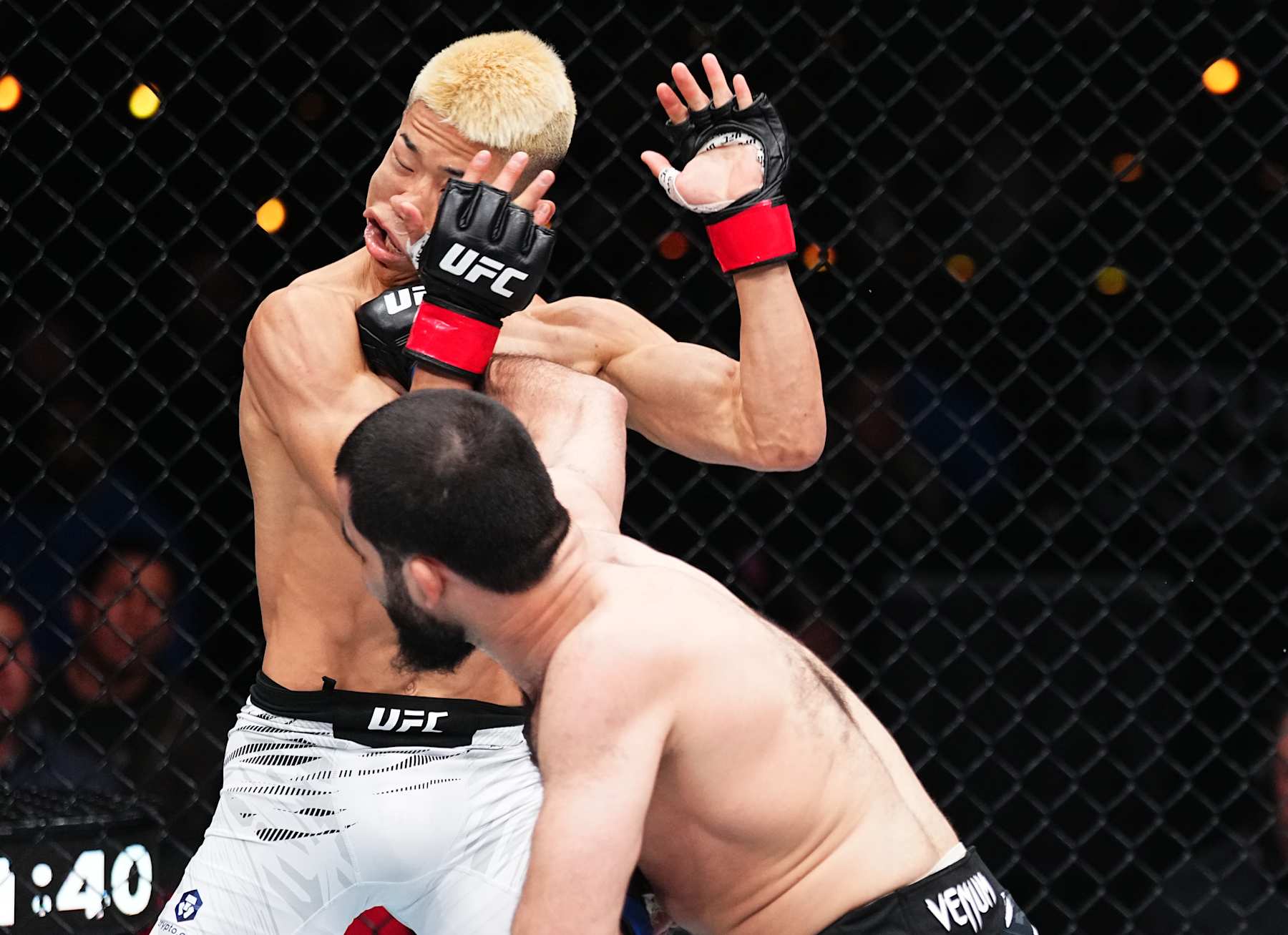 INGLEWOOD, CALIFORNIA - JANUARY 18: (R-L) Muin Gafurov of Tajikistan punches Rinya Nakamura of Japan in a bantamweight fight during the UFC 311 event at Intuit Dome on January 18, 2025 in Inglewood, California. (Photo by Jeff Bottari/Zuffa LLC)