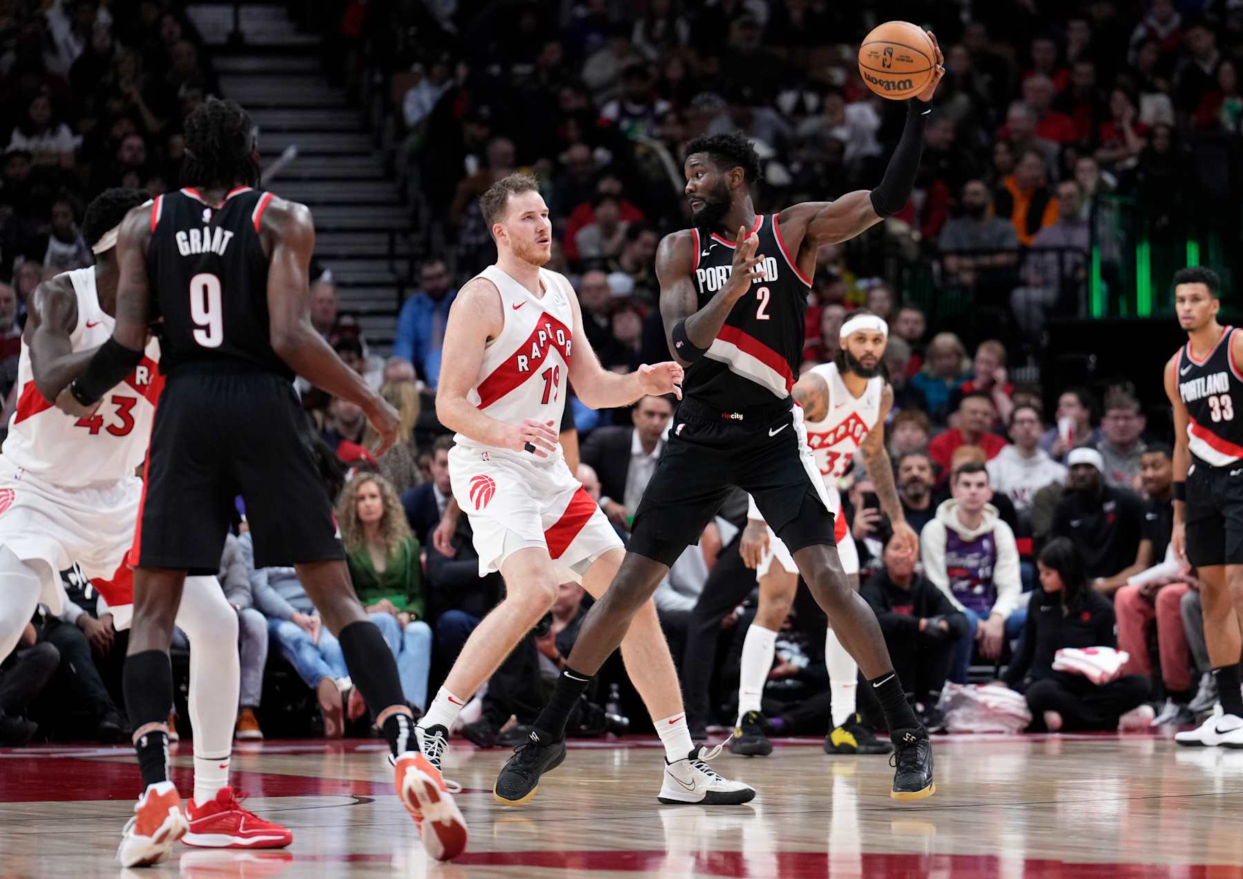 TORONTO, ON - OCTOBER 30: Deandre Ayton #2 of the Portland Trail Blazers holds the ball against Jakob Poeltl #19 of the Toronto Raptors during the second half of their basketball game at the Scotiabank Arena on October 30, 2023 in Toronto, Ontario, Canada. NOTE TO USER: User expressly acknowledges and agrees that, by downloading and/or using this Photograph, user is consenting to the terms and conditions of the Getty Images License Agreement. (Photo by Mark Blinch/Getty Images)